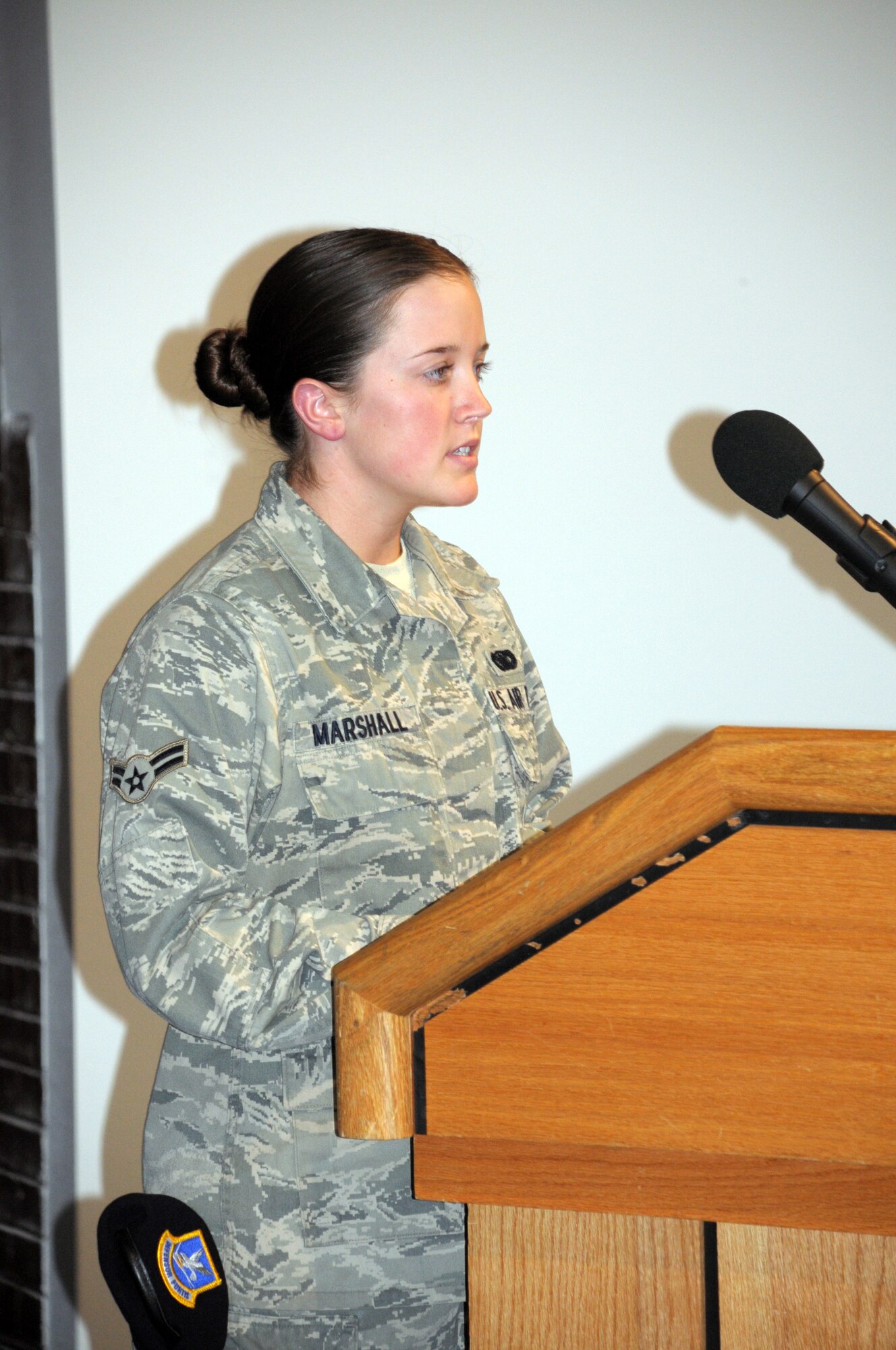 Airman 1st Class Meagan Marshall, 90th Security Forces Squadron, addresses those in attendance during Retreat in the Fall Hall Community Center May 20 during Warren’s National Police Week observance. (U.S. Air Force photo by Matt Bilden)