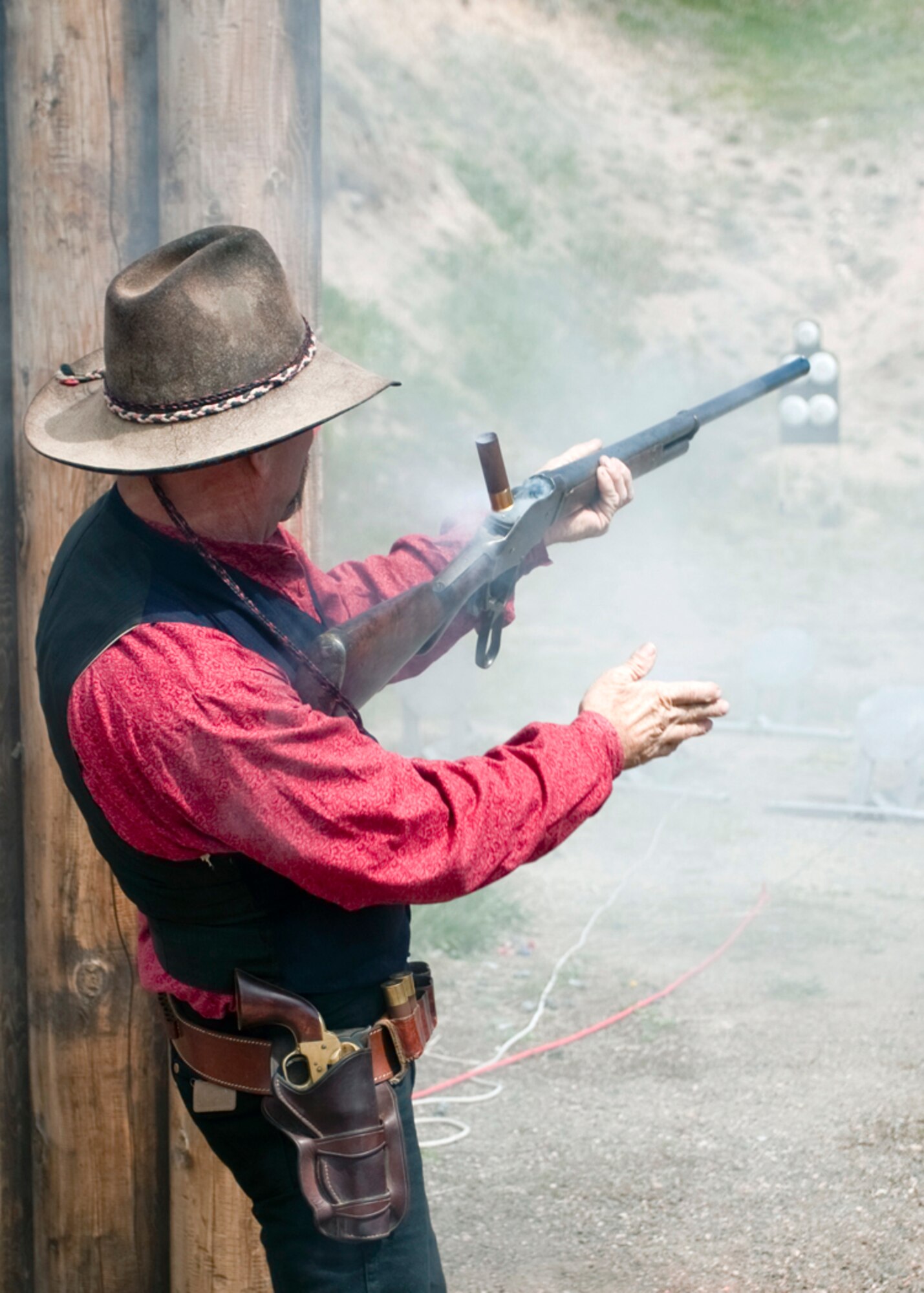 Chris “Badger” Schneider fires a round down-range with his shotgun at the Warren firing range here Sunday as part of the Cops vs. Cowboys competition between members of Warren’s security forces and the Cheyenne Police Department during the National Police Week observance. (U.S. Air Force photo by Matt Bilden)
