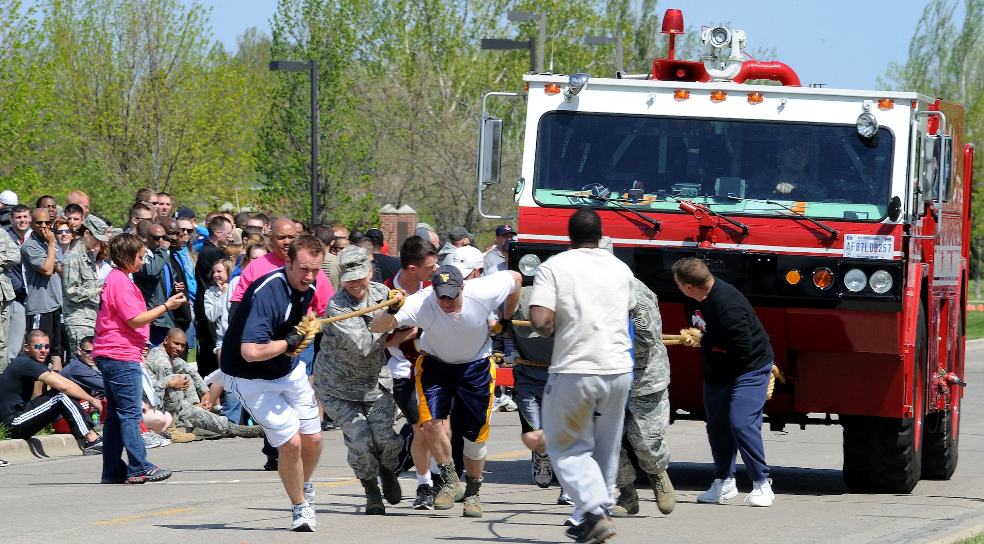 Members of the 319th Medical Group compete in the Clash of the Ironman May 25 during the base’s annual Spring Fest competitions. The day included various events to boost the morale of servicemembers and their families. (U.S. Air Force photo by Senior Airman Amber Bennett)