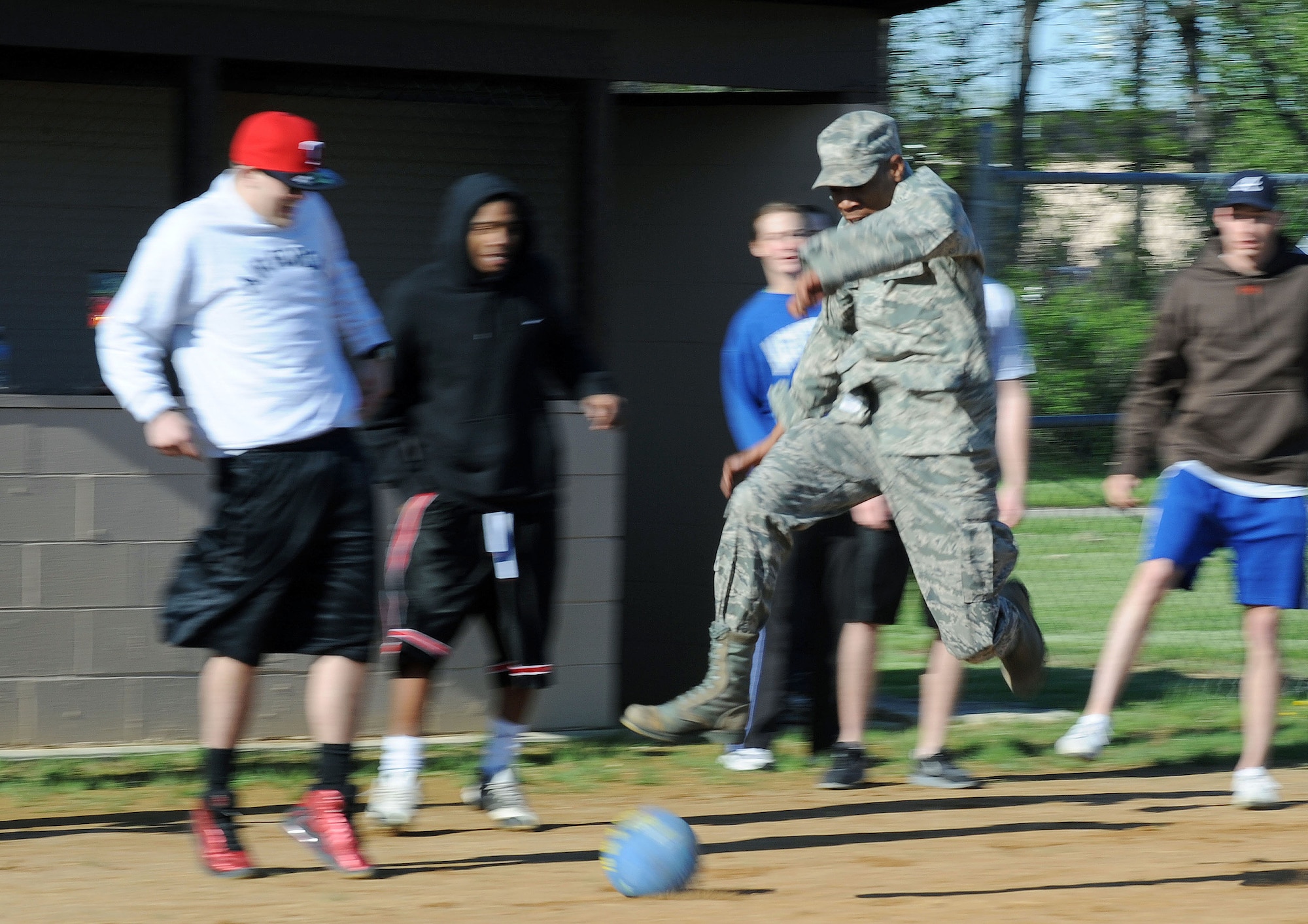 Airman 1st Class Donte Walker, 319th Operations Support Squadron, dodges the ball as he runs for home plate May 25 during the base’s annual Spring Fest competitions. The day included various events to boost the morale of servicemembers and their families. (U.S. Air Force photo by Senior Airman Amber Bennett)