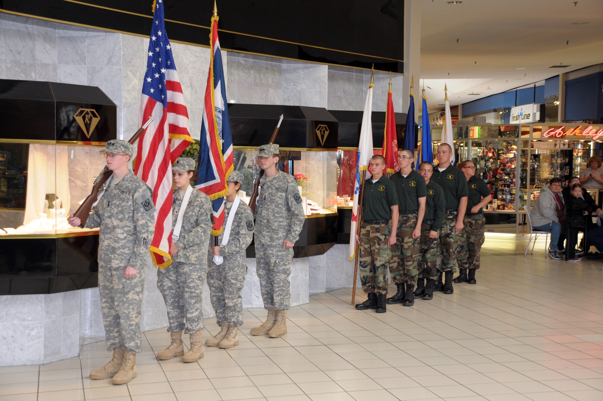 Members of the local Junior Reserve Officer Training Corps and members of the Wyoming National Guard Youth Challenge Program stand ready as color guard during Armed Forces Day celebrations in the Frontier Mall Saturday (U.S. Air Force photo by Blaze Lipowski)