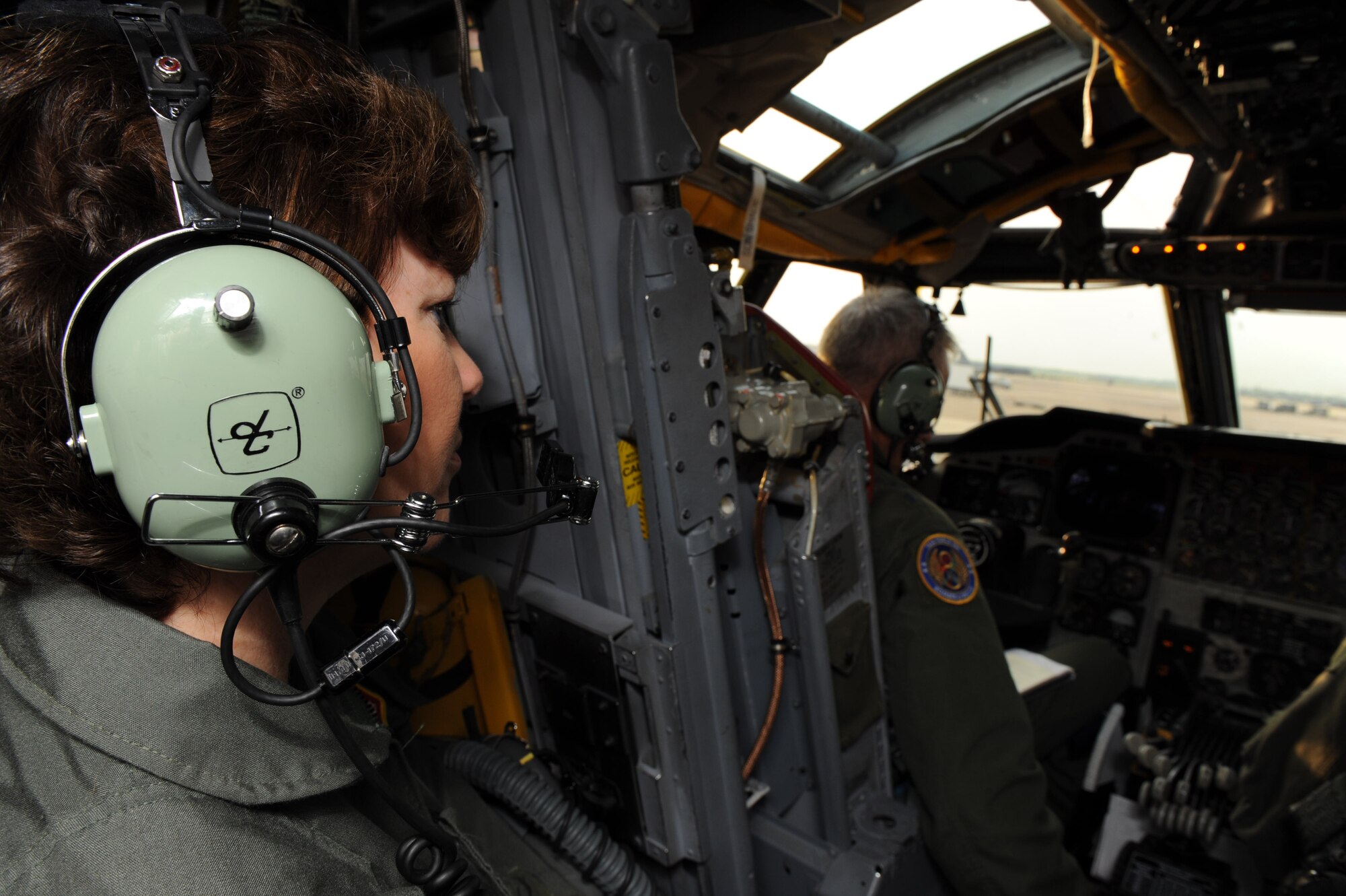 Melissa Carpenter sits in the flight cabin while her husband, Maj. Gen. Floyd Carpenter, 8th Air Force commander, reviews the pre-flight check list before his final B-52H Stratofortress flight on Barksdale Air Force Base, La., May 24. General Carpenter is retiring after 33 years of service and 3,000 flight hours in the B-52. (U.S. Air Force photo/Airman 1st Class Micaiah Anthony) (RELEASED)