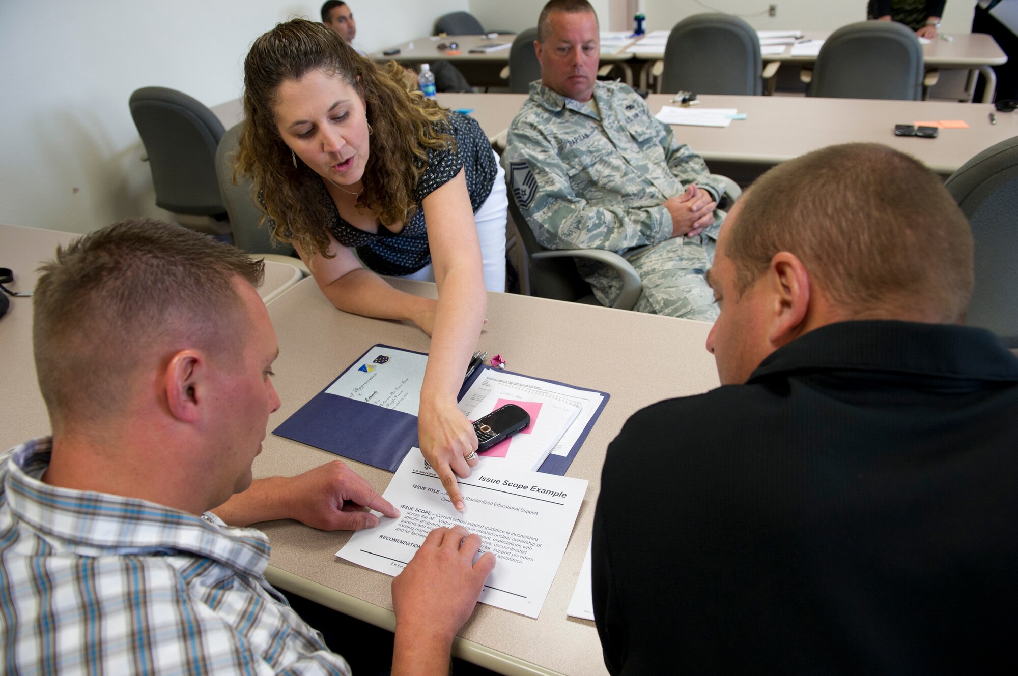 HOLLOMAN AIR FORC BASE, N.M. -- Reservists from the 44th Fighter Group review Air Force polices, May 24, 2011, during Holloman’s Caring for People Forum, held at the base’s education center. These working groups were initiated in 2009 by Air Force leadership to gather quality of life feedback on issues, which will be addressed at the installation, Air Combat Command and Air Force levels. (U.S. Air Force photo by Senior Airman Veronica Stamps/Released)