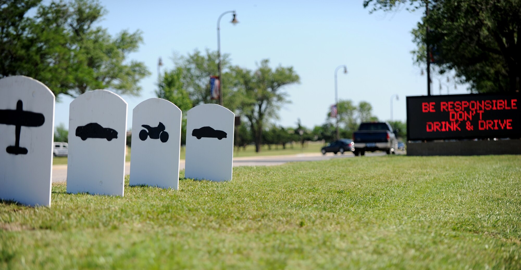 Tombstones placed on the side of the road symbolize 22 Air Force fatalities May 26, 2011, McConnell Air Force Base, Kan. The tombstones represent lives lost since January 2011. During the summer the Air Force typically experiences more safety mishaps due to increased outdoor leisure activities. The goal of the campaign is to ensure all Airmen have an injury-free summer. (U.S. Air Force Photo/Airman 1st Class Katrina M. Brisbin)