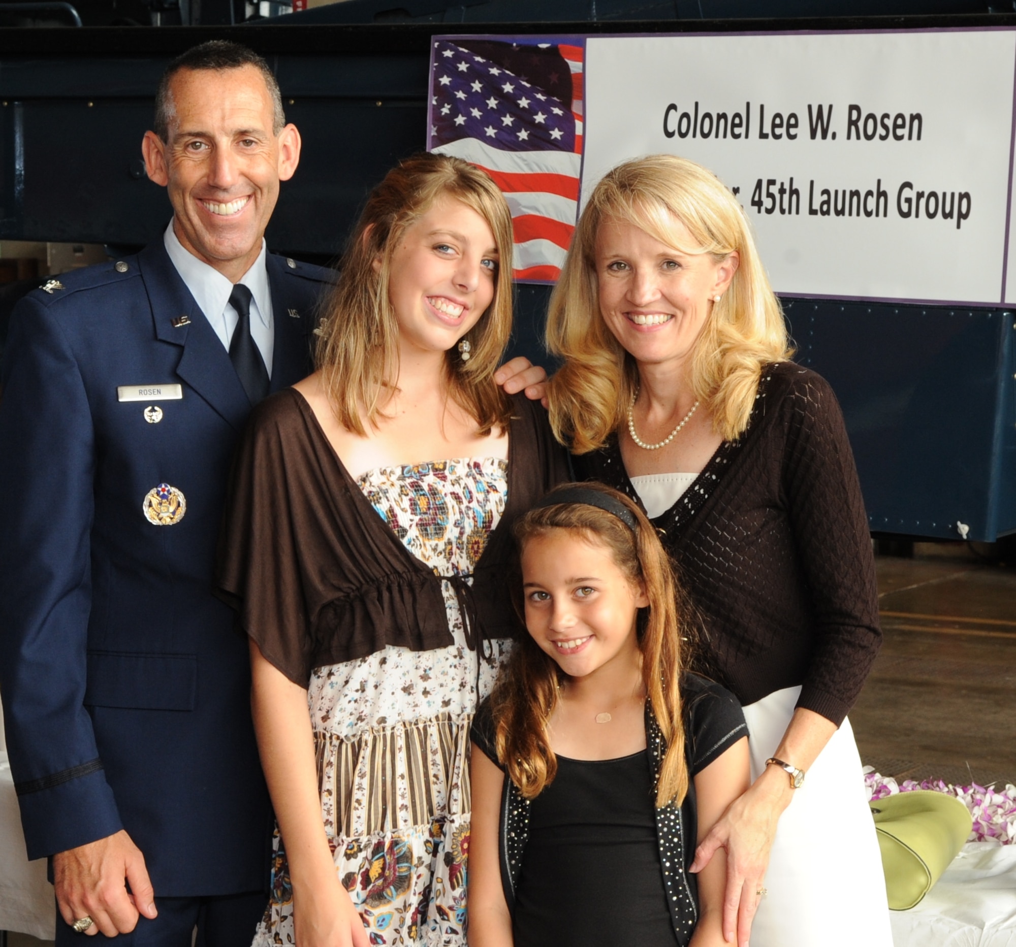 Col. Lee W. Rosen, with wife Dorothea and daughters Emma, left,
and Lili, right. “There’s no question that my greatest success is my
beautiful family. Family is the reason that we all do what we do; to
ensure we serve and protect them and our way of life.”
