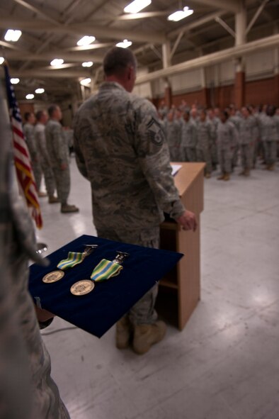 MOODY AIR FORCE BASE, Ga.-- Armed Forces Service Medals to be presented to 823rd and 820th Combat Operations Squadron Airmen for their efforts downrange are held by the proffer during an award ceremony May 20. Due to the high number of recipients, the awards were presented to the highest and lowest ranking Airmen during the ceremony, but all 41 Airmen were recognized by Gen. William M. Fraser III, commander of Air Combat Command and distinguished visitor. (U.S. Air Force photo/Airman 1st Class Joshua Green)(RELEASED)
