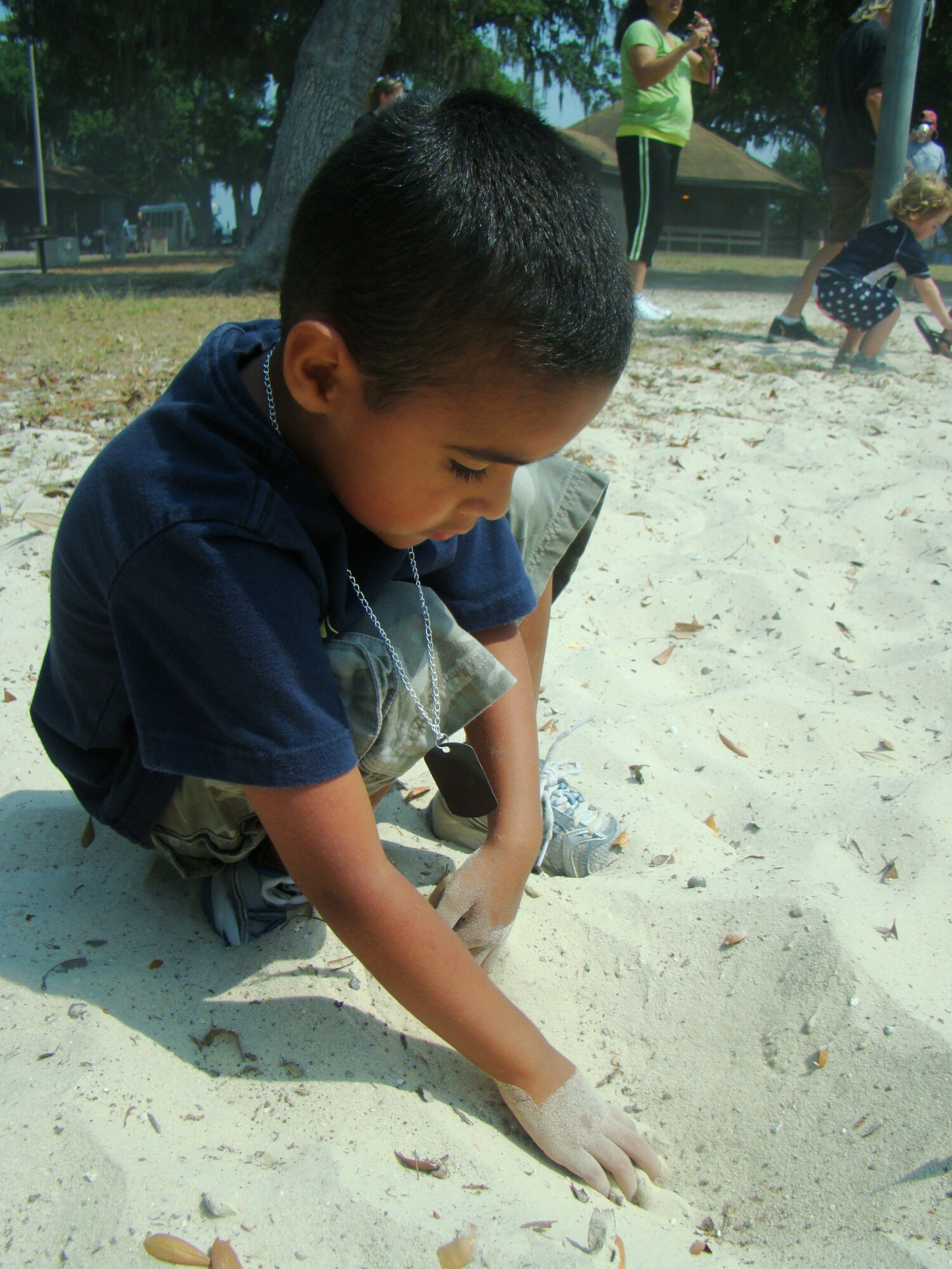 Kaleb Wilkerson, 4, digs for buried treasure.  His parents are Staff Sgt.Wesley and
Dania Wilkerson, 81st Diagnostics and Therapeutics Squadron. Kaleb’s dad is
currently deployed to Southwest Asia.  (U.S. Air Force photo by Airman 1st Class
Heather Heiney)