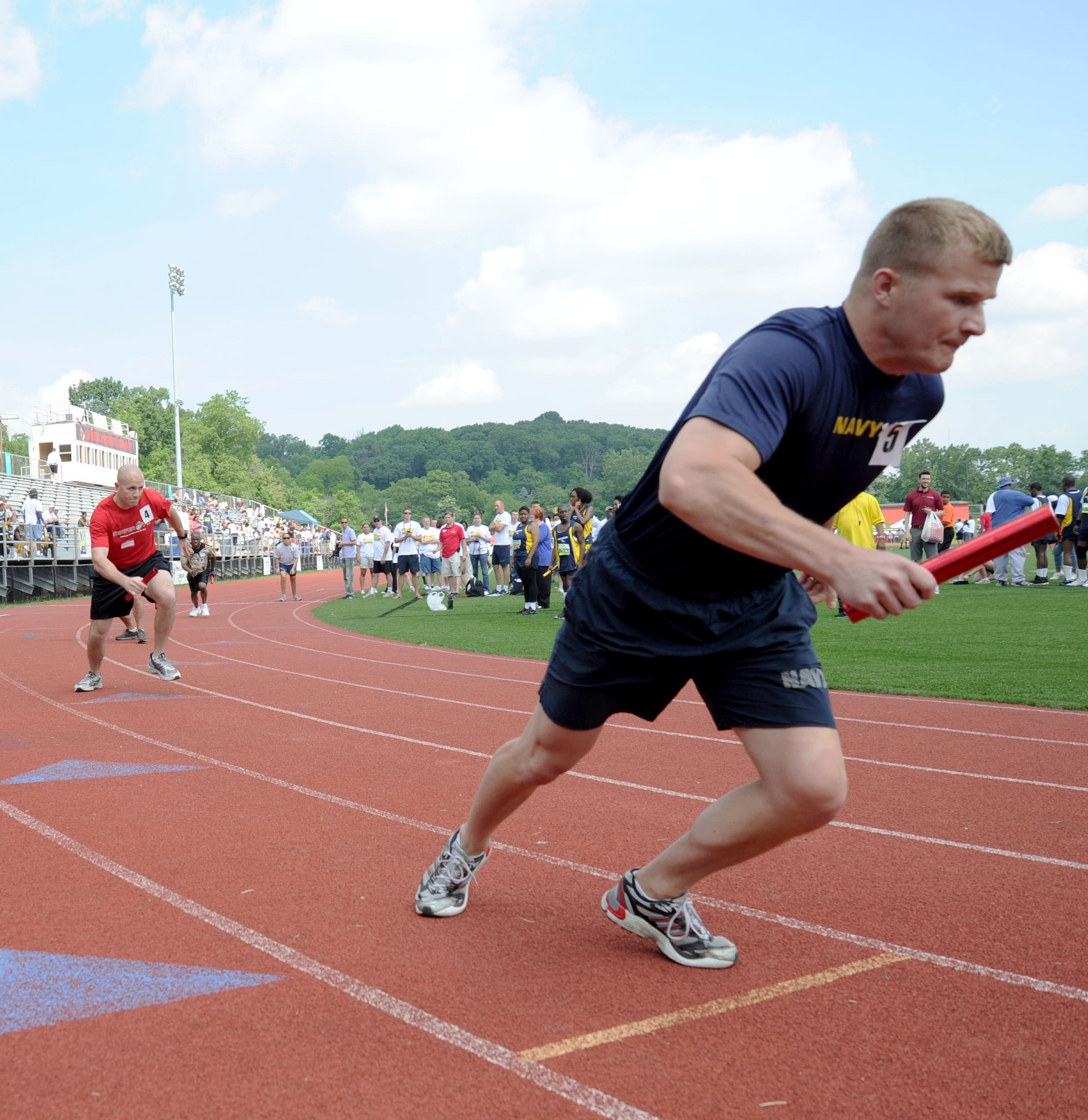 Five servicemembers from each military branch open Day 2 of the D.C. Special Olympics with a unified relay team race consisting of servicemembers and Special Olympics athletes during the games, held May 24-26 at the Catholic University of America’s athletic facility, Washington D.C. Special Olympics competitors were supported by 246 servicemembers representing every branch of the military.