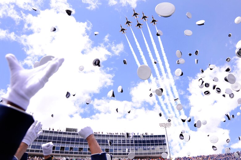 The Air Force Thunderbirds Aerial Demonstration Squadron leads off the hat toss at the end of the Air Force Academy's Class of 2011 graduation ceremony May 25, 2011, at Falcon Stadium in Colorado Springs, Colo. (U.S. Air Force photo/Ray McCoy)