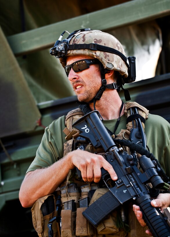 Tech. Sgt. Jason Parker guards a group of vehicles during the Combat Aviation Advisor course’s Raven Claw exercise May 24 at Duke Field, Fla.  As part of the exercise, 19 CAA students deployed to a foreign nation to advise and train their air forces in fixed wing and rotary aircraft operations.  The four-day exercise is the capstone of 12 weeks of baseline certification training for CAA.  The year-long process to become a CAA also includes months of language and flight training.  (U.S. Air Force photo/Tech. Sgt. Samuel King Jr.)