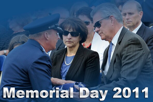 Air Force leaders issued a Memorial Day statement to Airmen and their families May 24, 2011. In this photo, Air Force Academy Superintendent Lt. Gen. Mike Gould presents Larry and Joyce Brodeur with a flag during the May 17, 2011, funeral service for Maj. David Brodeaur, a 1999 Academy graduate who was killed April 27 in Kabul, Afghanistan. (U.S. Air Force photo/Megan Davis)
