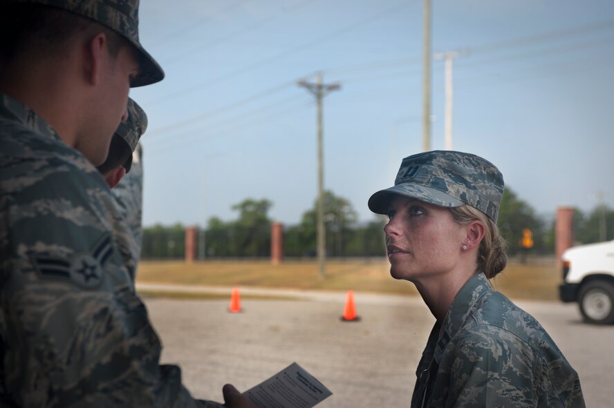 MOODY AIR FORCE BASE, Ga. -- Capt. Amanda Peter, 23rd Aerospace Medicine Squadron nurse manager for flight medicine, interviews a patient who shows signs of infection during a point of distribution exercise, May 25. Players in the POD drove through a series of checkpoints to receive medical paperwork, information, medicine and vaccinations.  (U.S. Air Force photo/ Airman 1st Class Jarrod Grammel)(RELEASED)