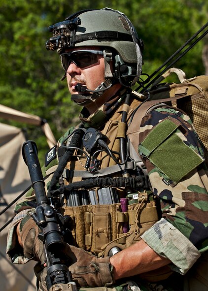 Tech. Sgt. Britton Adams, team medic, watches and waits after his team heard sounds of a firefight west of his camp during the Combat Aviation Advisor course’s Raven Claw exercise May 24 at Duke Field, Fla.  As part of the exercise, 19 CAA students deployed to a foreign nation to advise and train their air forces in fixed wing and rotary aircraft operations.  The four-day exercise is the capstone of 12 weeks of baseline certification training for CAA.  The year-long process to become a CAA also includes months of language and flight training. (U.S. Air Force photo/Tech. Sgt. Samuel King Jr.)