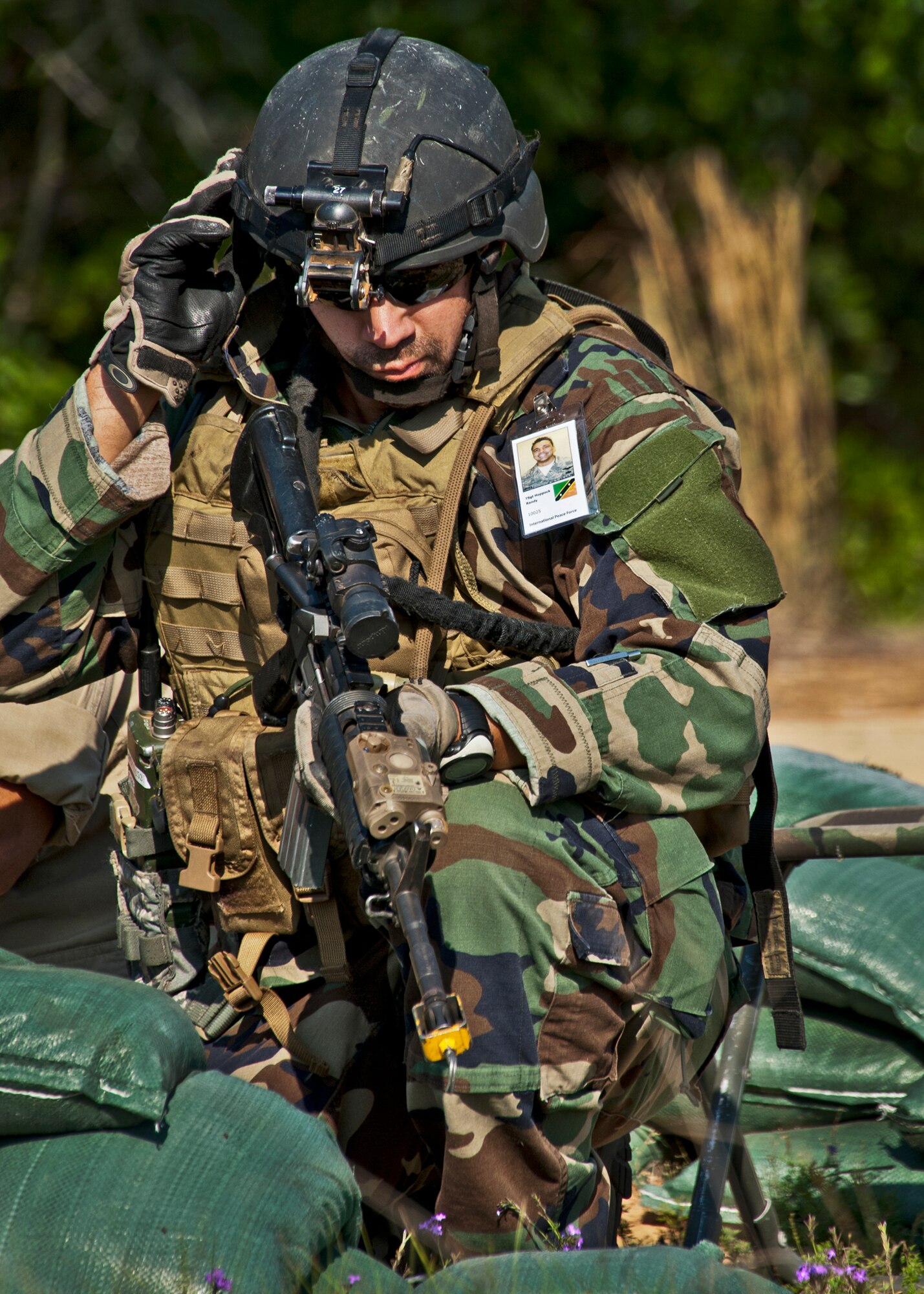 Tech. Sgt. Randy Hoppock, 5th Special Operations Squadron, prepares for battle after his team heard sounds of a firefight west of their camp during the Combat Aviation Advisor course’s Raven Claw exercise May 24 at Duke Field, Fla.  Sergeant Hoppock and four other 5th SOS Airmen completed the course and earned their air commando badges.  They are the first reservists to ever take the course, which prepares Airmen to deploy to partner nations to train personnel to engage in air operations. (U.S. Air Force photo/Tech. Sgt. Samuel King Jr.)