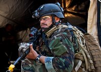 Maj. Michael Black, 5th Special Operations Squadron, guards the control center tent after his team heard sounds of a firefight west of their camp during the Combat Aviation Advisor course’s Raven Claw exercise May 24 at Duke Field, Fla.  Major Black and four other 5th SOS Airmen completed the course and earned their air commando badges.  They were the first reservists to ever take the course, which prepares Airmen to deploy to partner nations to train personnel to engage in air operations. (U.S. Air Force photo/Tech. Sgt. Samuel King Jr.)