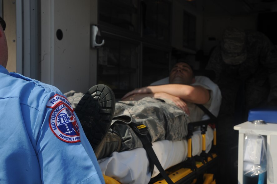Staff Sgt. Matthew Fitzgerald, 23rd Aerospace Medicine Squadron, gets transported into an ambulance during a point of distribution exercise May 25 at Moody Air Force Base, Ga. Sergeant Fitzgerald played a patient in the simulation where he suffered from lack of hydration. (U.S. Air Force photo/Airman 1st Class Paul Francis)(RELEASED)