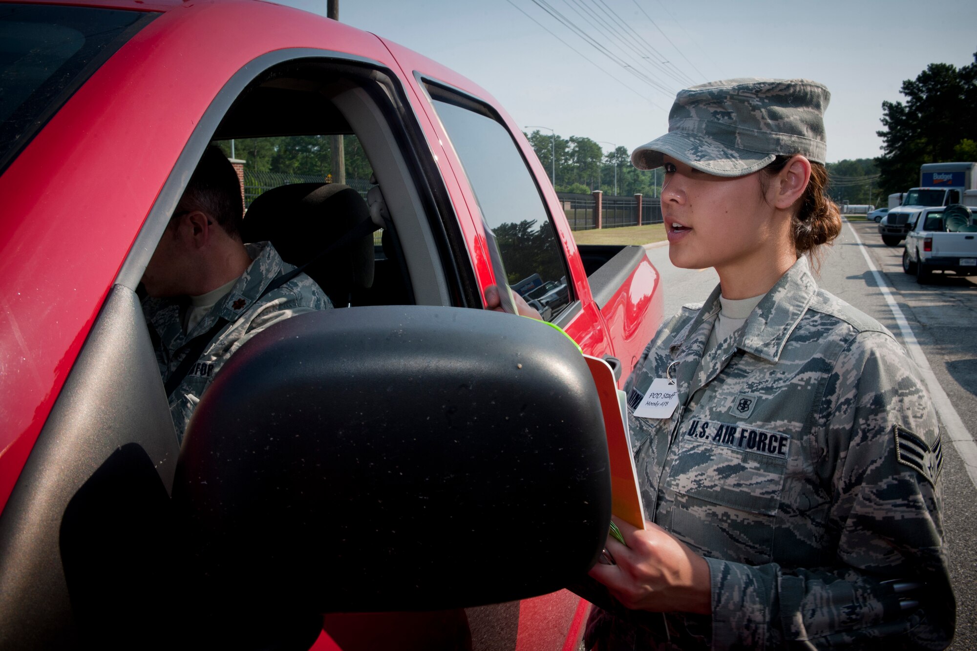 MOODY AIR FORCE BASE, Ga.-- Senior Airman Kelsie Schindley, 23rd Medical Group patient administration, receives patients information and directs simulated patients during a point of distribution exercise May 25. A point of distribution would be used in cases of mass deployments or a medical epidemic. (U.S. Air Force photo/Airman 1st Class Benjamin Wiseman)(RELEASED)