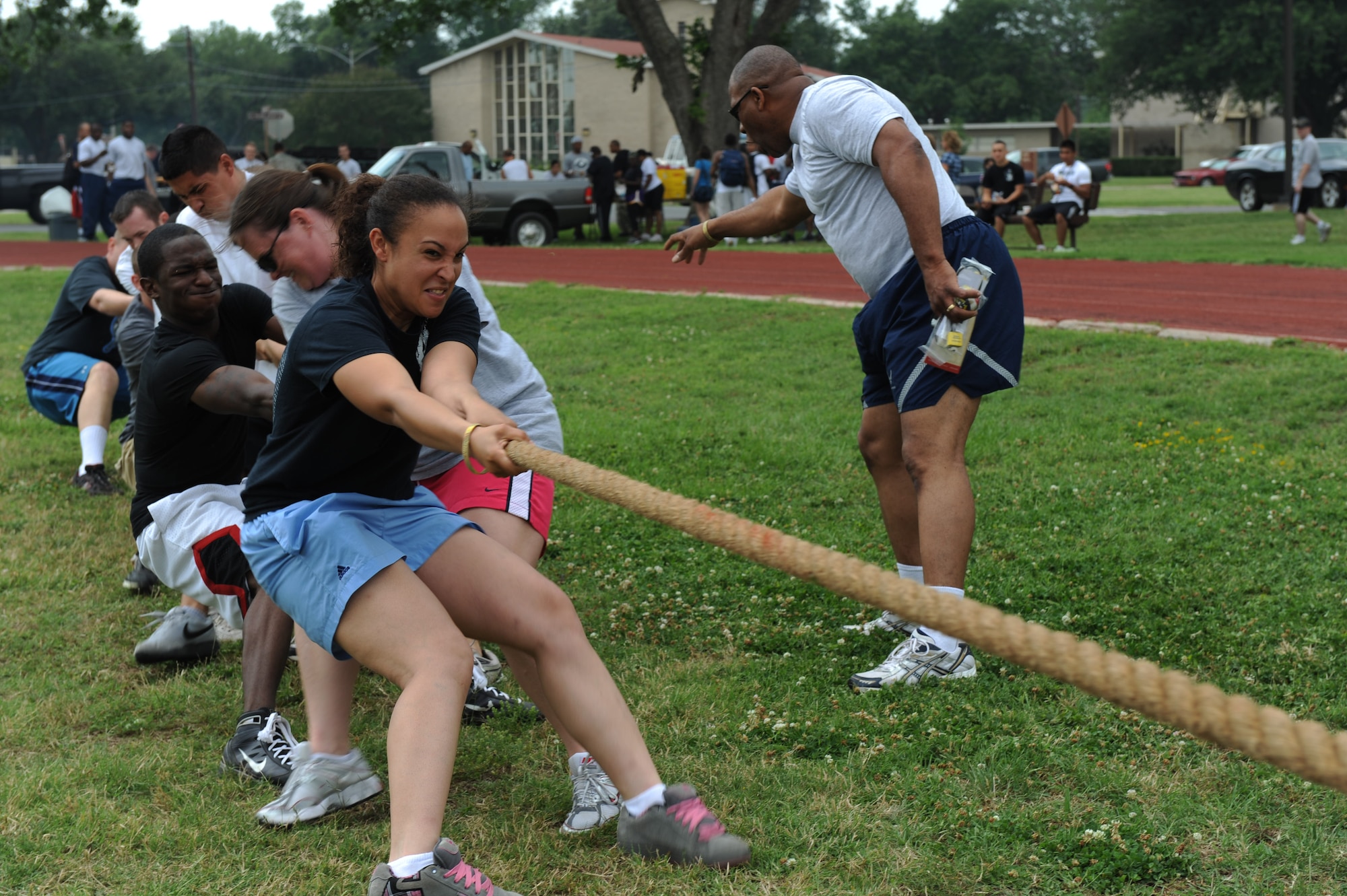 Airmen from the 2nd Munitions Squadron pull a rope during the 2nd Bomb Wing Sports Day tug-of-war competition on Barksdale Air Force Base, La., May 25. Sports day was organized by the 2nd Force Support Squadron to build unit morale and boost physical fitness for the month of May which is fitness month. (U.S. Air Force photo/Airman 1st Class Micaiah Anthony) (RELEASED) 