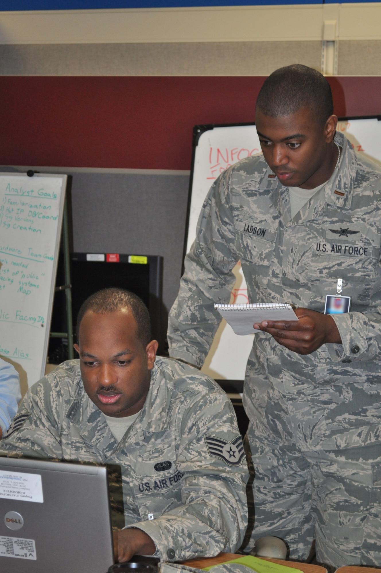 Second Lt. Franklin Ladson, 83rd Network Operations Squadron crew commander out of Langley Air Force Base, Va., oversees the Scott Air Force Base, Ill., team competing in Cyber Nexus, the 67th Network Warfare Wing's first ever force-on-force competition May 19. This multi-disciplined team won the competition by the small margin of 92 points over the team based out of the Gunter Annex at Maxwell Air Force Base, Ala. "Those of you who participated in this event, you are pioneers," said Col. Kevin Wooton, 67th NWW commander. The competition was held May 17-19. (U.S. Air Force photo by Mary von Tobel)