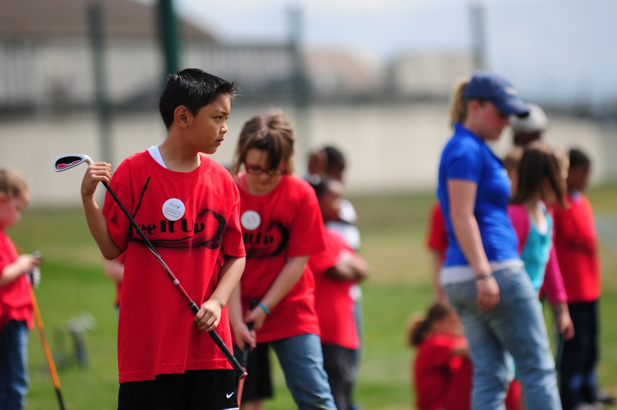 SPANGDAHLEM AIR BASE, Germany – Zephaniah Driz watches his golf ball roll onto the green while participating in the youth golf clinic at the Eifel Mountain Golf Course here May 20.The clinic was taught by Tee it Up Inc. and sponsored by the 52nd Force Support Squadron to teach the youth how to play the game. (U.S. Air Force photo/Airman 1st Class Matthew Fredericks)