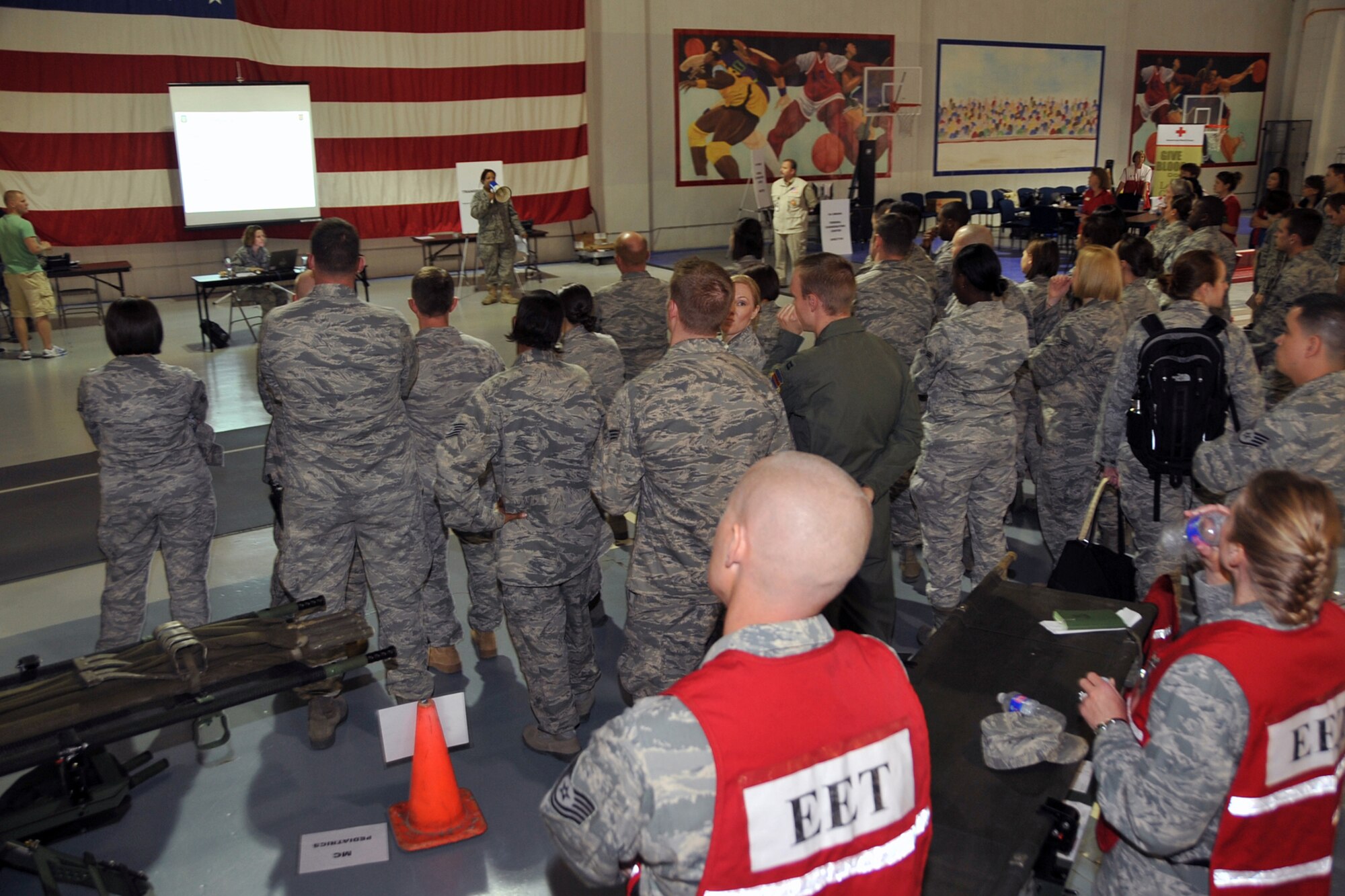 OFFUTT AIR FORCE BASE, Neb. --Captain Felisa Wilson from the 55th MDG, briefs participants preparing for the event. Offutt Afb performed a national level exercise for 2011 on May 19 at the field house. Many participants were on hand for the NDMS Exercise, including many base agencies from Omaha simulating real life transporting of medical personel and victims acting out and responding giving medical care in case of a community emergency. U.S. Air Force Photo by Jeff W. Gates.