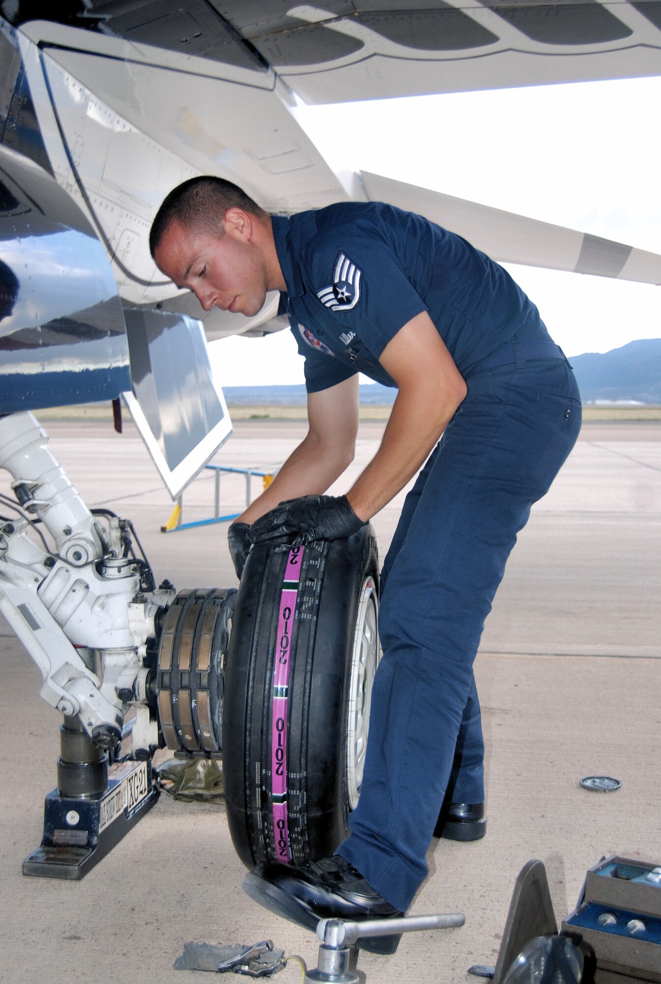 PETERSON AIR FORCE BASE, Colo. –Staff Sgt. Luke Miller, aircraft maintenance for the Air Force Thunderbirds, replaces a tire on one of the Thunderbird’s six F-16s that were on Peterson Air Force Base, May 23, 2011. The Thunderbirds landed at Peterson AFB for the U.S. Air Force Academy graduation where they performed a flyover and demonstration as part of the 2011 graduation ceremony, held May 25. (U.S. Air Force photo/Airman 1st Class Jessica Hines) 