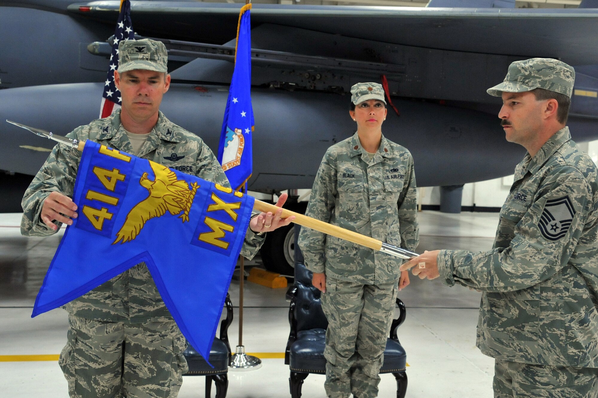 SEYMOUR JOHNSON AIR FORCE BASE, N.C.- Col. Keith Acree unveils the 414th Maintenance Squadron guidon during an activation and appointment of command ceremony here, May 26, 2011. The unveiling of the guidon signifies the beginning of a new unit. Colonel Acree is the 414th Fighter Group commander. (U.S. Air Force photo/Senior Airman Whitney Lambert) 