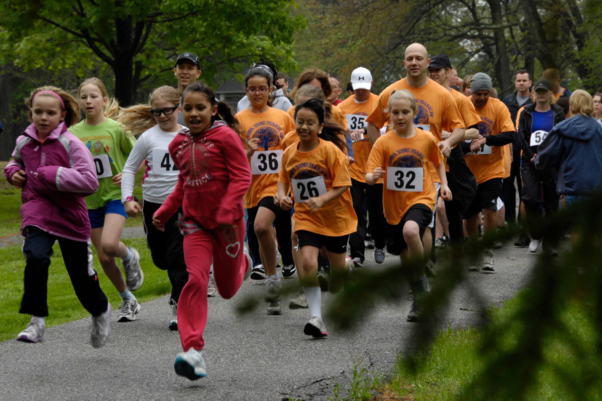 HANSCOM AIR FORCE BASE, Mass. – Hanscom Middle School students and their parents take off for the HOPA race at Castle Park May 18. This is the 26th running of the race, named after the Hopa Crabapple trees planted many years ago near the finish line of the three mile race. (U.S. Air Force photo by Linda LaBonte Britt)