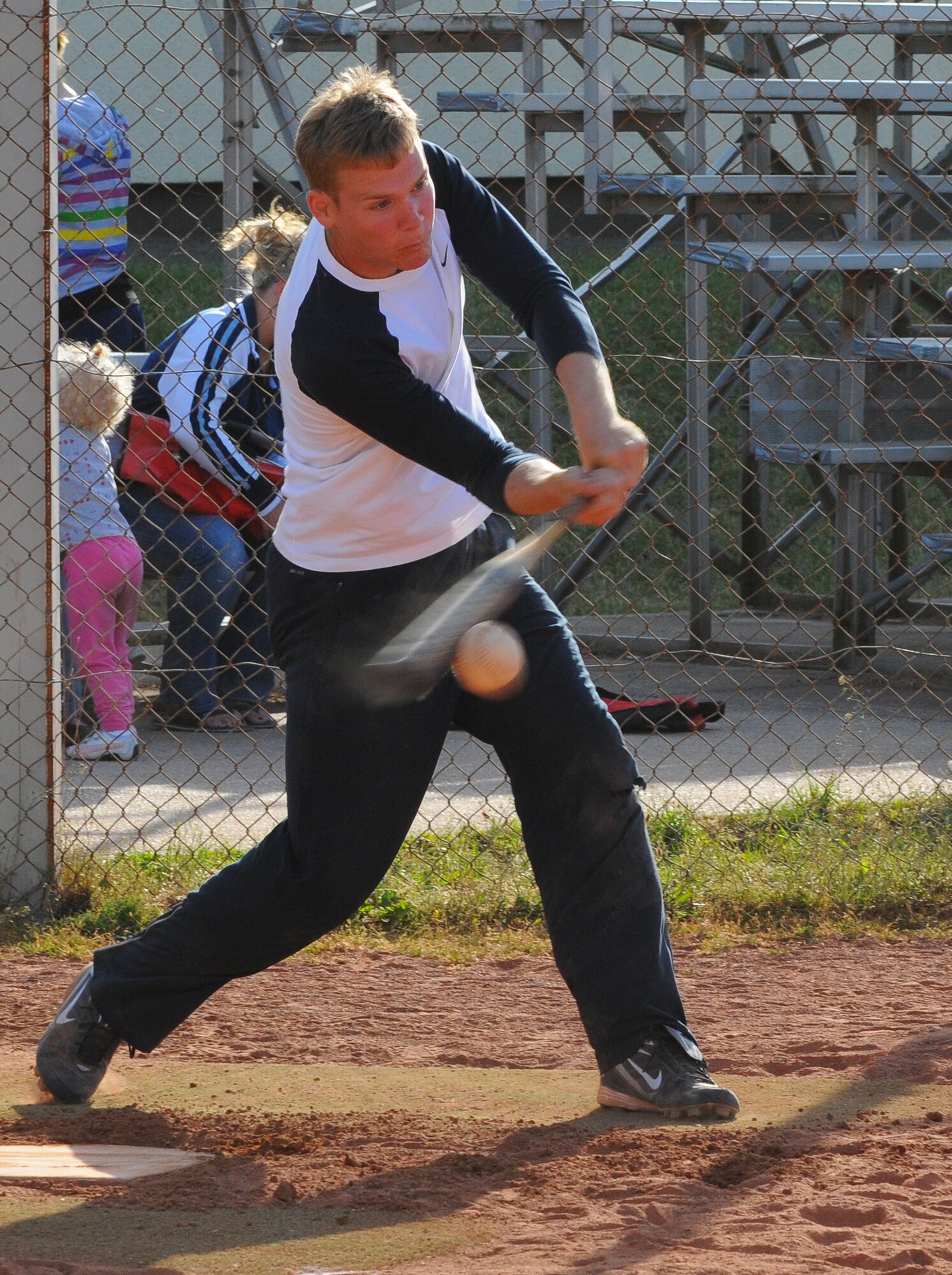 SPANGDAHLEM AIR BASE, Germany -- Andrew Trautmann, 52nd Security Forces Squadron, takes a cut on the ball during an intramural softball game here May 24. The 52nd Logistics Readiness Squadron defeated the 52nd SFS 10-8. The intramural softball league began May 23 and runs into August 2011.  (U.S. Air Force photo/Airman 1st Class Dillon Davis)
