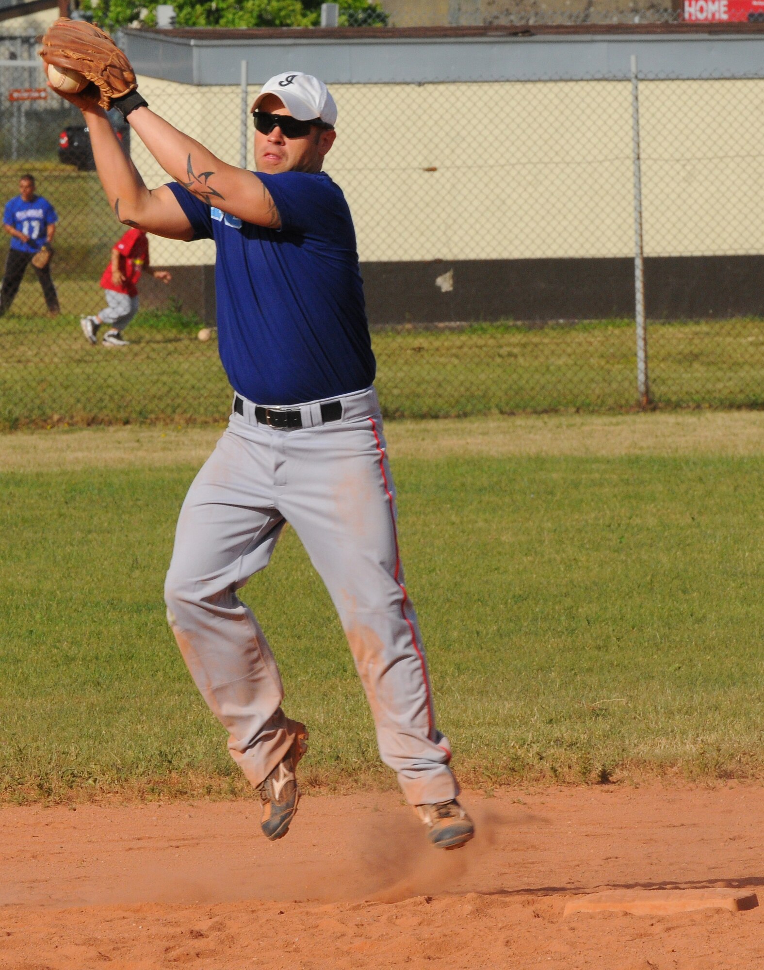 SPANGDAHLEM AIR BASE, Germany -- Brian Cikity, 52nd Security Forces Squadron, catches makes an in-field catch during an intramural softball game here May 24. The 52nd Logistics Readiness Squadron defeated the 52nd SFS 10-8. The intramural softball league began May 23 and runs into August 2011.  (U.S. Air Force photo/Airman 1st Class Dillon Davis)