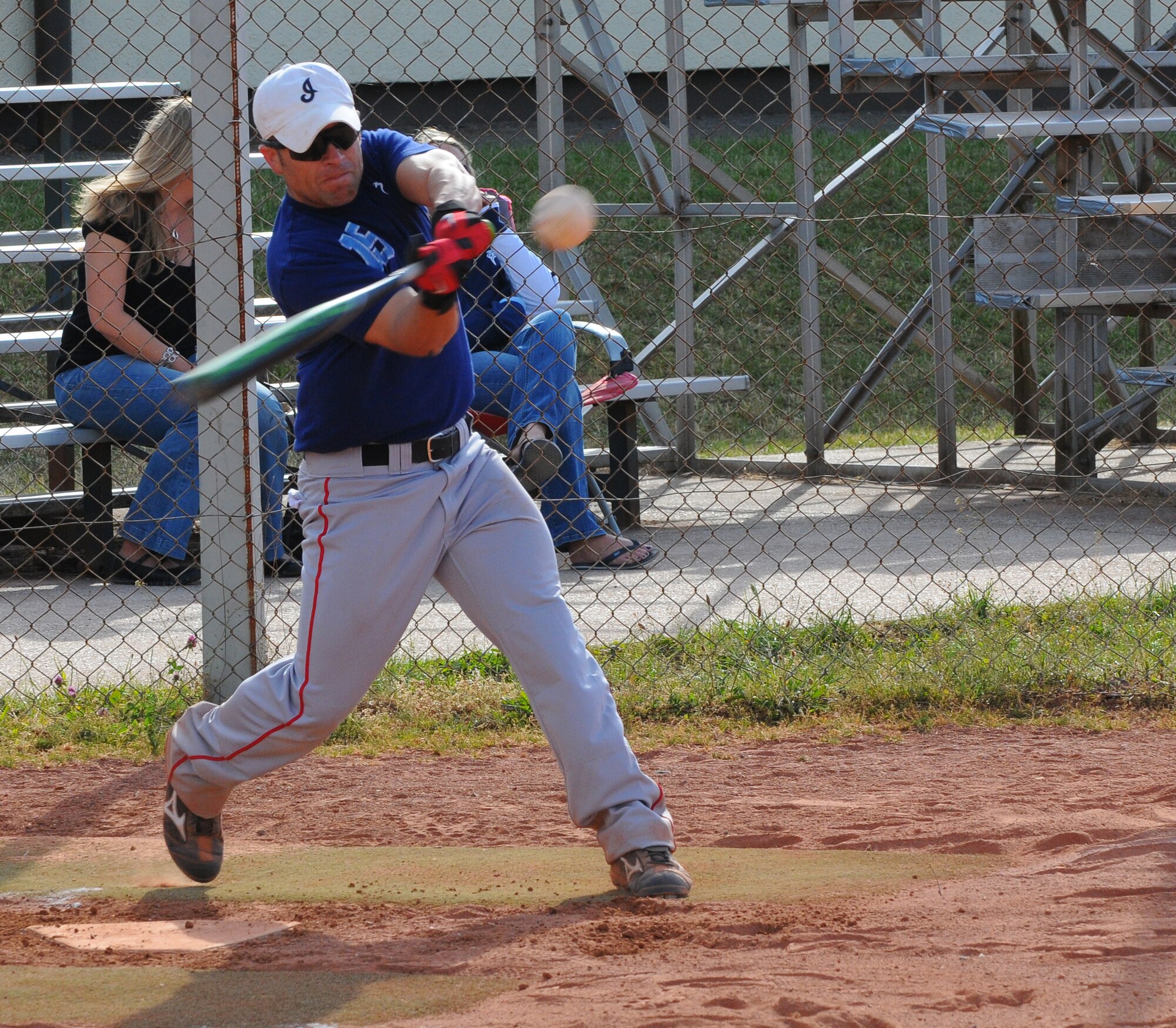 SPANGDAHLEM AIR BASE, Germany – Brian Cikity, 52nd Security Forces Squadron, swings at a softball during an intramural softball game here May 24. The 52nd Logistics Readiness Squadron defeated the 52nd SFS 10-8. The intramural softball league began May 23 and runs into August 2011.  (U.S. Air Force photo/Airman 1st Class Dillon Davis)