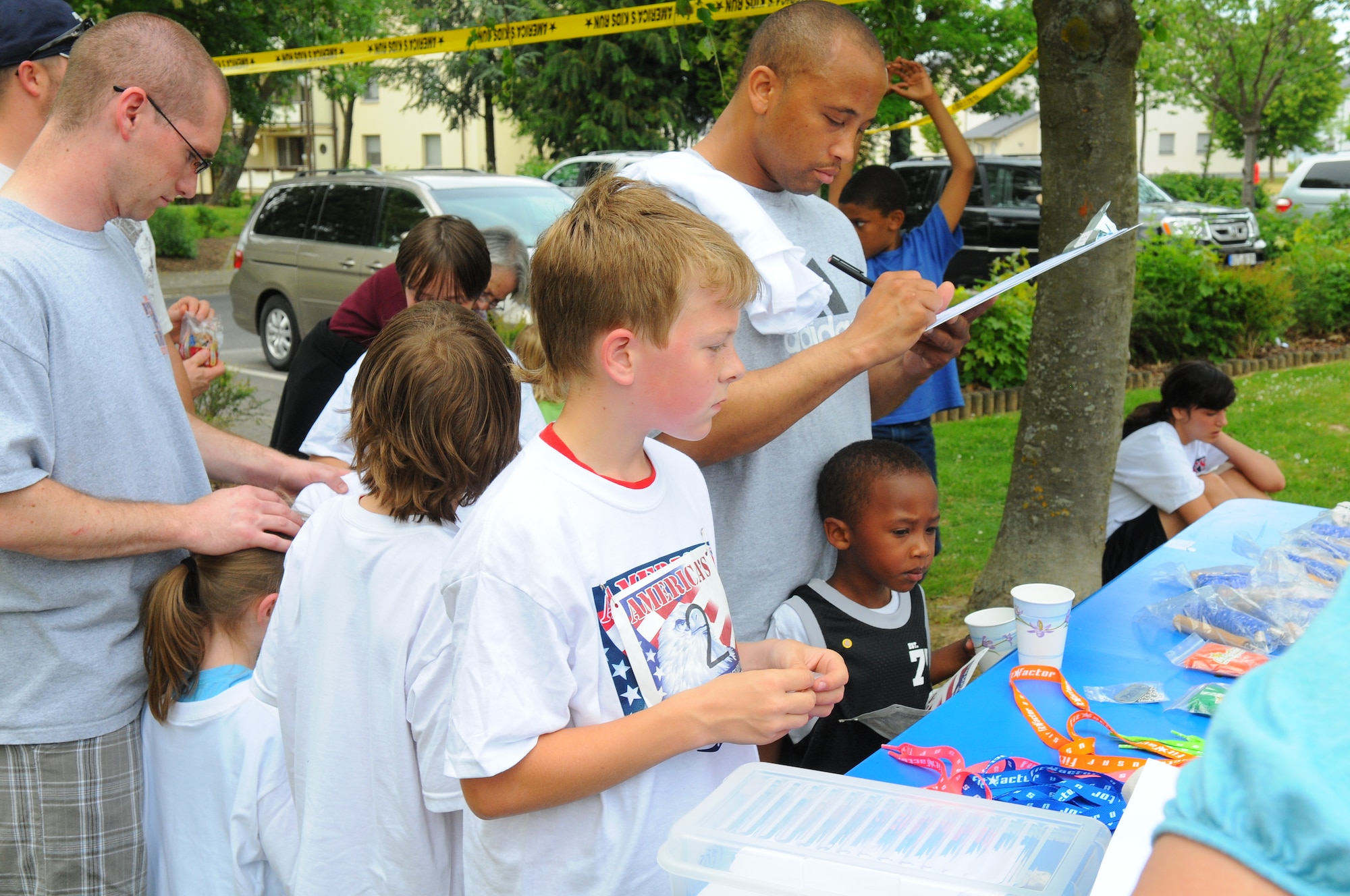 SPANGDAHLEM AIR BASE, Germany – Children from Spangdahlem Elementary School and Spangdahlem Middle School line up to receive prizes at the Armed Forces Kids’ Run here May 20. The Armed Forces Kids’ Run happens every year in May and includes military children in Germany, the U.S., Bahrain, Greece, Puerto Rico, Japan, Iceland, England and Italy. (U.S. Air Force photo/Airman 1st Class Dillon Davis)