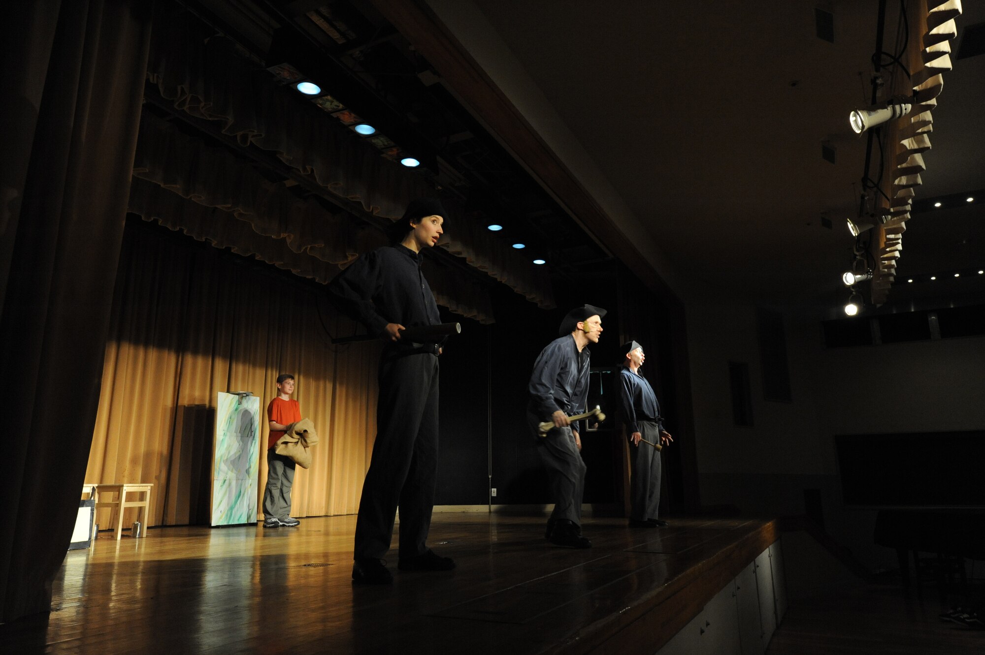 MISAWA AIR BASE, Japan -- As part of the performance Joshua Driskell, 11, son of David Driskell, 35th Operations Support Squadron weather technician, was falsely accused of being a thief and was brought up on stage for his punishment during the International Theater Company London play, "Much Ado About Nothing," at the Mokuteki Community Center May 20.  That night, more than 220 members of the base community came to see the performance.  (U.S. Air Force photo Staff Sgt. April Quintanilla)