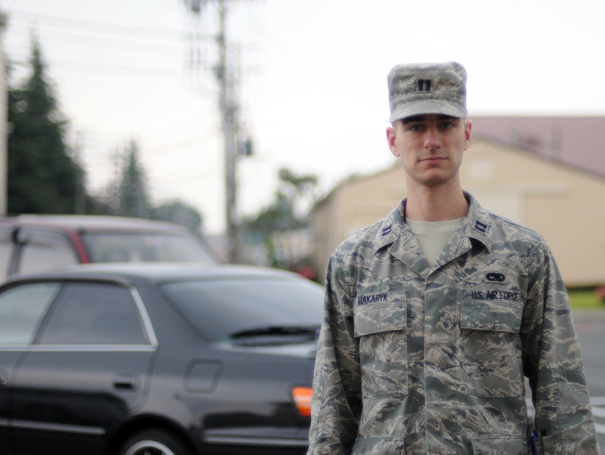 YOKOTA AIR BASE, Japan -- Capt. Michael Makaryk, 374th Maintenance Squadron operations officer, poses for a picture and expresses what Memorial Day means to him May 26, 2011, Yokota Air Base, Japan. Captain Makaryk said, "Memorial Day is about taking time to honor the sacrifices of our brothers and sisters in arms who have helped shape our nation into what it is today. We owe them a debt of gratitude too large to repay, but Memorial Day is one way to live up to our oath as Soldiers, Sailors, Airmen, and Marines." (U.S. Air Force photo/Airman 1st Class Krystal M. Garrett) 
