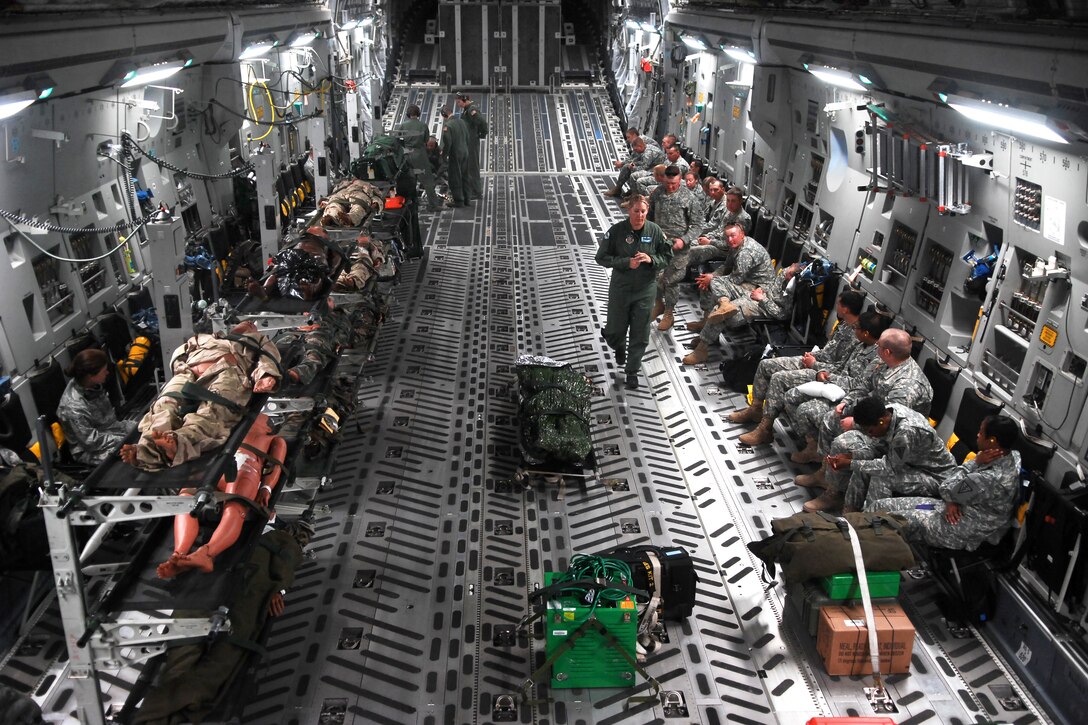 Air Force airmen perform a simulated aeromedical evacuation mission aboard a C-17 Globemaster III aircraft during Global Medic 2011 and Warrior 91 11-01 training at Fort Hunter Liggett, Calif., May 21, 2011. The airmen are assigned to the 43rd, the 446th and the 911th aeromedical evacuation squadrons.