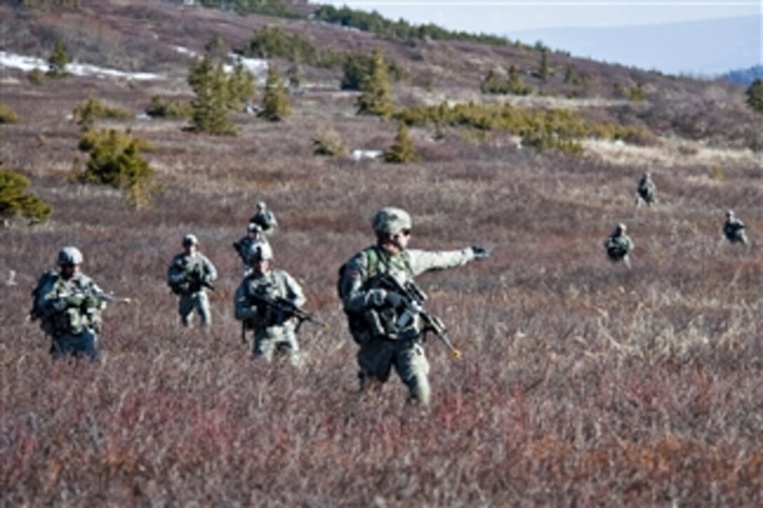 Army soldiers make their way through Alaska's Chugach Mountain Range during an air assault training exercise on May 12, 2011.  The soldiers are assigned to Company C, 1st Battalion, 501st Infantry Regiment.  