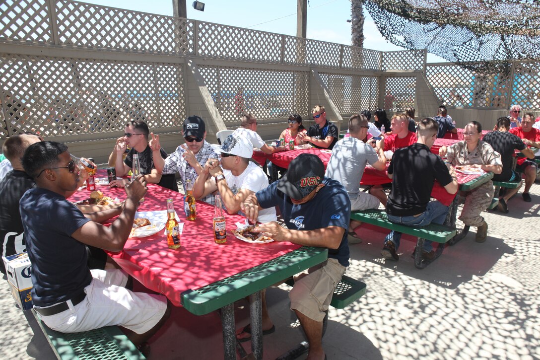 Marines and sailors from the 15th Marine Expeditionary Unit (MEU) enjoyed a pre-holiday barbeque at Camp Pendleton's Del Mar Beach, May 26. The event was held to help build camaraderie and a sense of family within the unit.