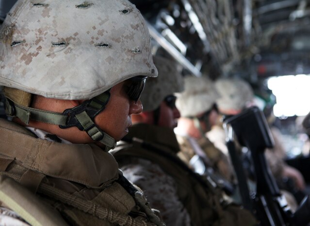 Sgt. Jamie Balderrama, a squad leader with Fox Company, 2nd Battalion, 9th Marine Regiment, prpares himself before conducting a beach assault demonstration at New York City's Coney Island, May 26, 2011. Various units from II Marine Expeditionary Force and Marines Forces Reserve have organized under the 24th MEU to form the Special Purpose Marine Air Ground Task Force - New York. The Marines embarked on the Navy’s Amphibious Assault Ships, the USS Iwo Jima (LHD -7) and USS New York (LPD-21) to take part in Fleet Week New York 2011 from May 25 to June 1. The Marines will showcase the capabilities of the MAGTF, and also honor those who have served by participating in various events during the Memorial Day weekend.