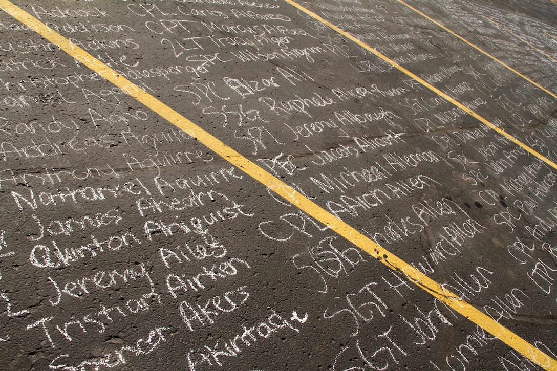 Instead of teaming with activity and overflowing with cars, nearly 6,000 names of service members killed during Operations Iraqi and Enduring Freedom were written and the ground as part of the Empty Parking Lot Project May 27. A handful of students started the project at 4:00 p.m., on Thursday and finished around 5:30 a.m., the following morning after snatching up all of the chalk from every store in Hudson, Wis. Event coordinator Ben Peters even had to make an extra trip to Woodbury, Minn., at 11:00 p.m., to buy additional supplies. Overall, students spent more than $100 on chalk to complete the project. For additional imagery from the event, visit www.facebook.com/rstwincities.