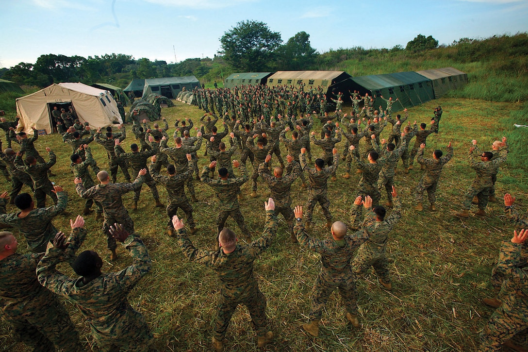 U.S. Marines and sailors with Landing Force Company conduct stretching exercises with Indonesian counterparts during Cooperation Afloat Readiness and Training 2011 in Antra Lina training area, Indonesia, May 27. Indonesian service members from 6th Battalion, 2nd Brigade, Korps Marinir, and U.S. service members from Landing Force Company, comprised primarily of Marines from 2nd Battalion, 23rd Marine Regiment, and 4th Assault Amphibian Battalion both from 4th Marine Division, Marine Forces Reserve, shared expertise and experience during the event.