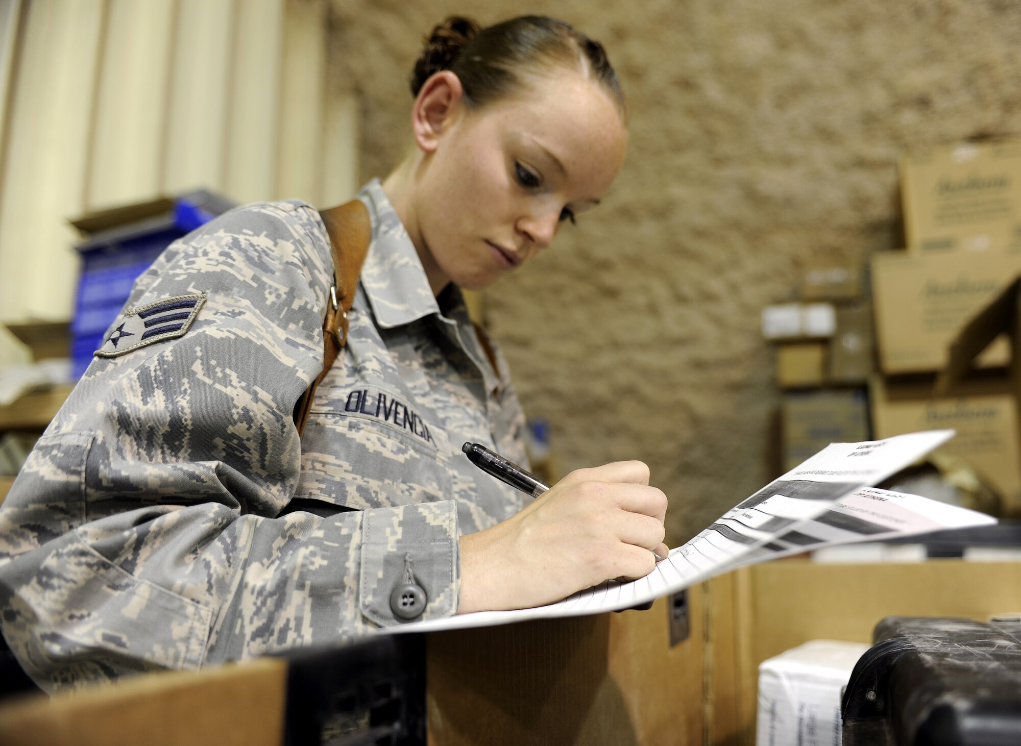 Senior Airman Ashlynd Olivencia verifies inventory in a kicker box May 25, 2011, at Kandahar Airfield, Afghanistan. Airman Olivencia is responsible for ordering all equipment and supplies for the 466th Explosive Ordinance Disposal Bravo Squadron.  Airman Olivencia is an EOD supply technician assigned to the 466th Explosive Ordinance Disposal Bravo Squadron. (U.S. Air Force photo by Senior Airman Willard E. Grande II)