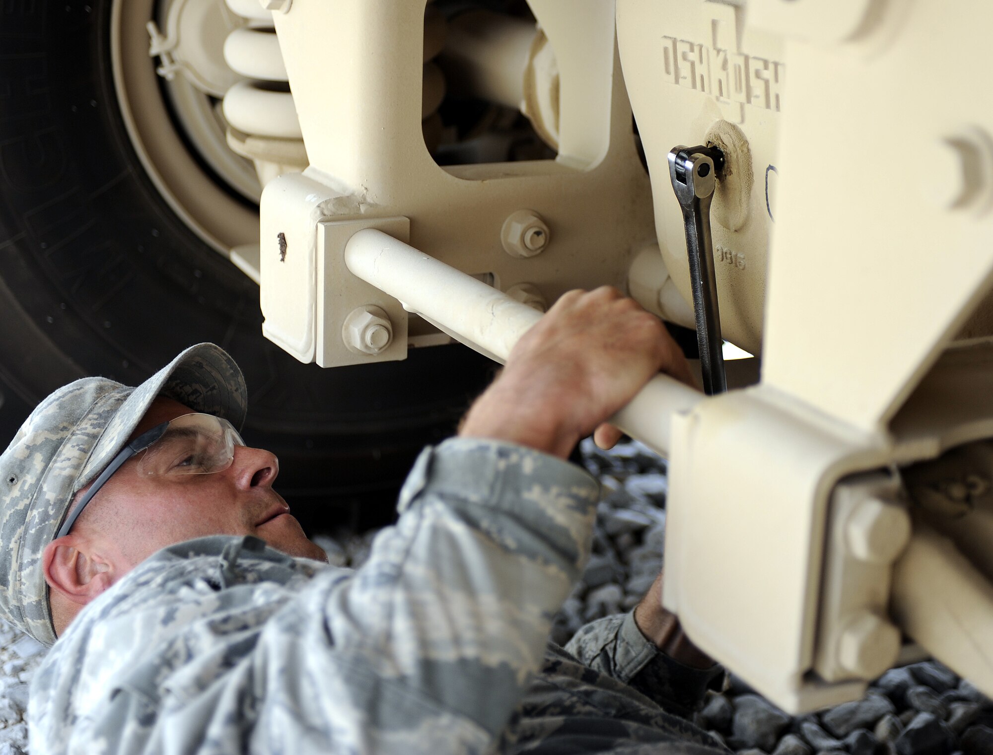 Tech Sgt. Brian Henry checks differential fluid in a mine resistant ambush protected all-terrain vehicle May 25, 2011, at Kandahar Airfield, Afghanistan. Sergeant Henry is in charge of maintaining about a dozen vehicles similar to the M-ATV in use by explosive ordinance disposal personnel.  Sergeant Henry is a vehicle mechanic assigned to the 466th Explosive Ordinance Disposal Bravo Squadron. (U.S. Air Force photo by Senior Airman Willard E. Grande II)