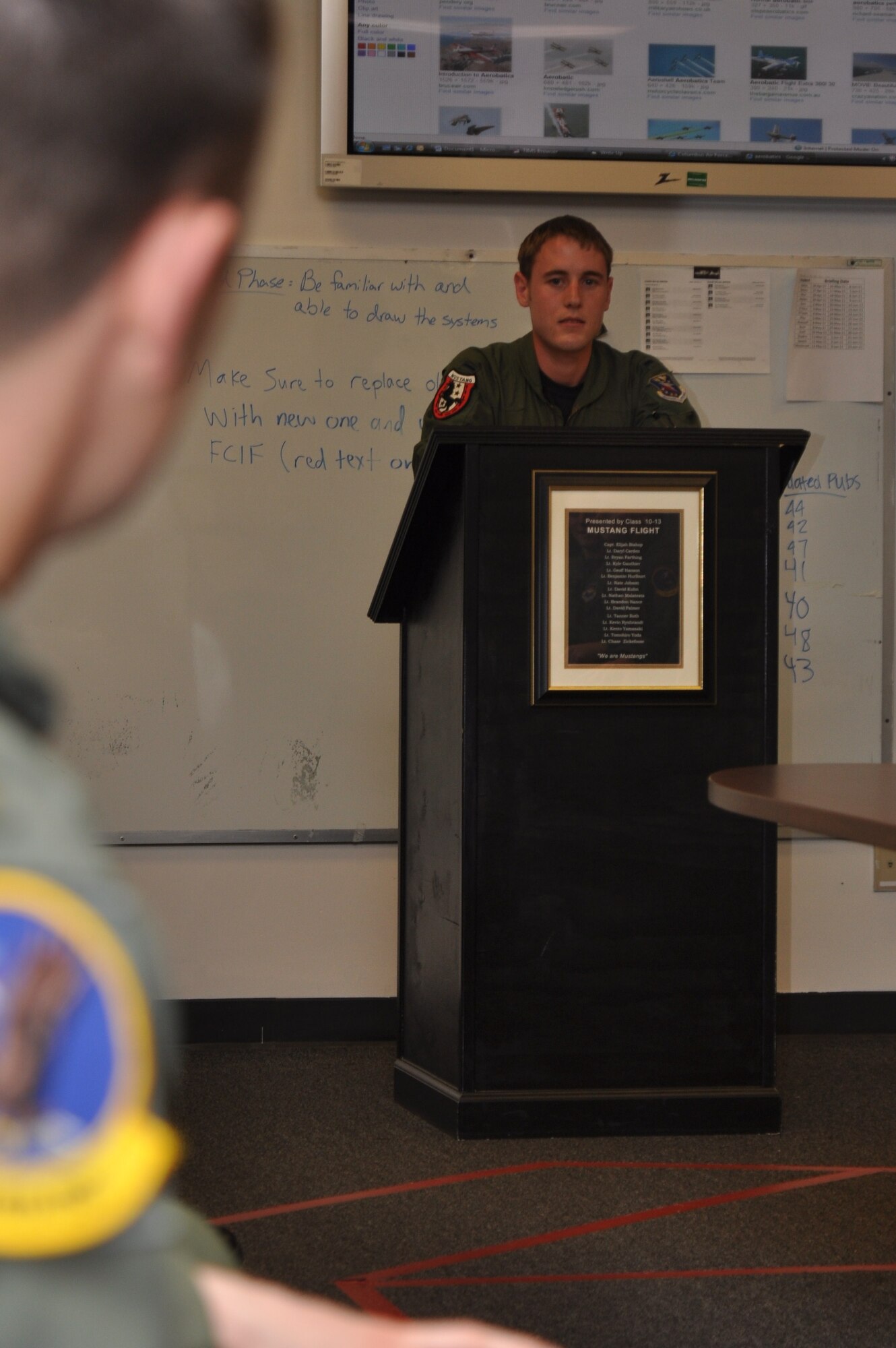 1st Lt. Michael Fleharty, 37th Flying Training Squadron Mustang Flight instructor pilot, answers a student's question during an end-of-day brief. (U.S. Air Force photo/Airman 1st Class Chase Hedrick)