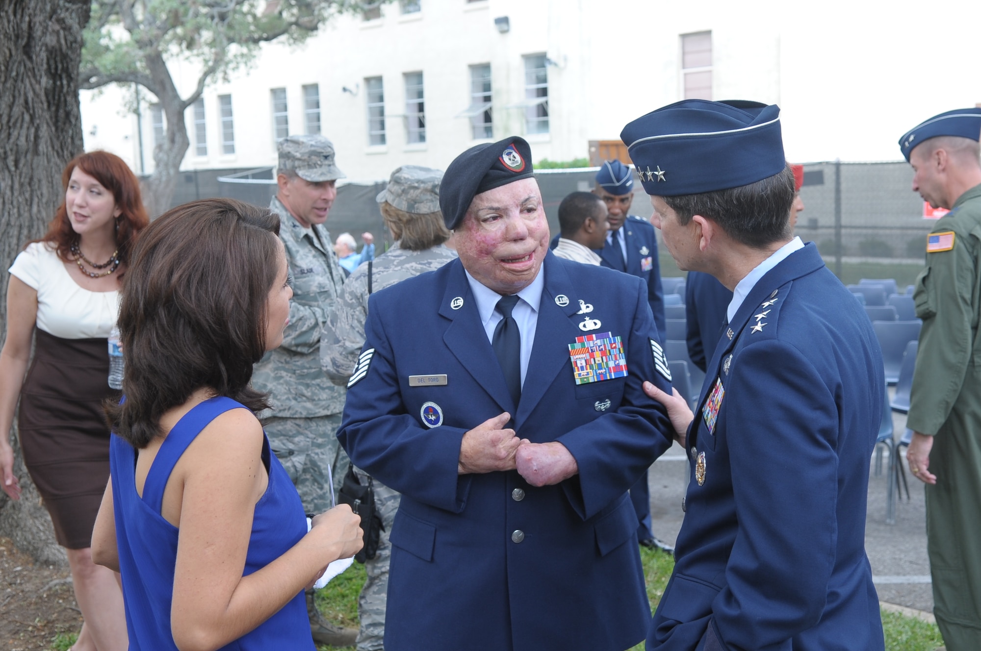 Lt. Gen. Darrell Jones, deputy chief of staff for manpower, personnel and services, talks with Tech. Sgt. Israel Del Toro Jr., after a ribbon cutting ceremony and grand opening for the Air Force's new Warrior and Family Operations Center May 25 at Randolph Air Force Base, Texas. Sergeant Del Toro was wounded in 2005 while deployed to Afghanistan. (Courtesy photo) 