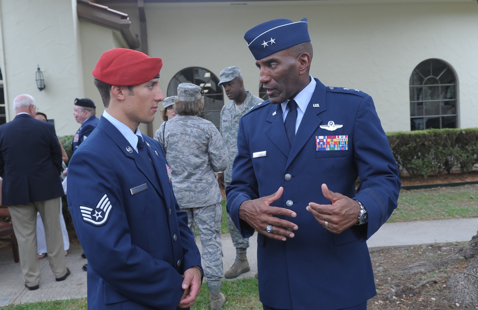 Maj. Gen. A.J. Stewart, commander of the Air Force Personnel Center, talks with Staff Sgt. Marc Esposito after a ribbon cutting ceremony and grand opening for the Air Force's new Warrior and Family Operations Center May 25 at Randolph Air Force Base, Texas. Sergeant Esposito was wounded in Afghanistan in May 2009. (Courtesy photo)