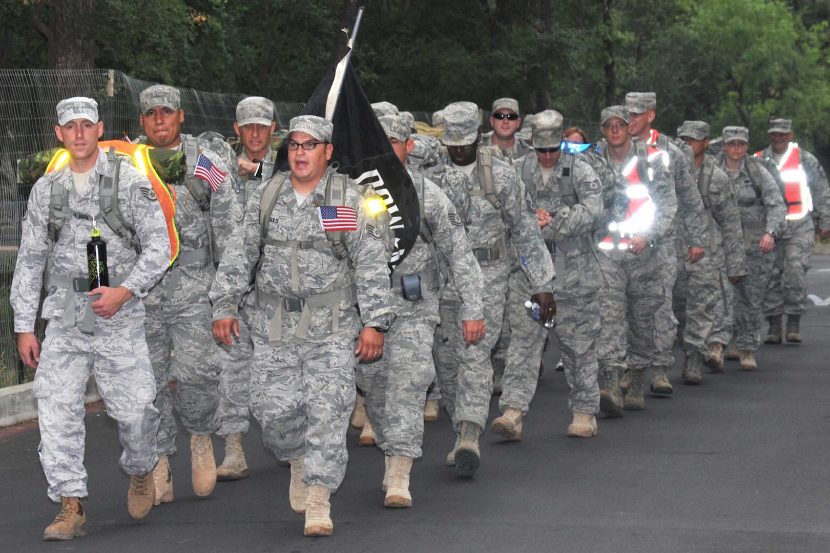 Joint Base San Antonio servicemembers begin a 14-mile ruck sack march at Phil Hardberger Park May 20. The servicemembers marched to Camp Bullis in honor of transportation professionals killed in Iraq and Afghanistan. (U.S. Air Force photo/Alan Boedeker)