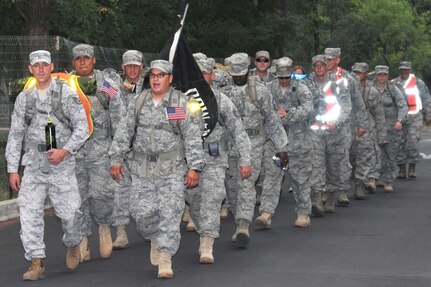 Joint Base San Antonio servicemembers begin a 14-mile ruck sack march at Phil Hardberger Park May 20. The servicemembers marched to Camp Bullis in honor of transportation professionals killed in Iraq and Afghanistan. (U.S. Air Force photo/Alan Boedeker)