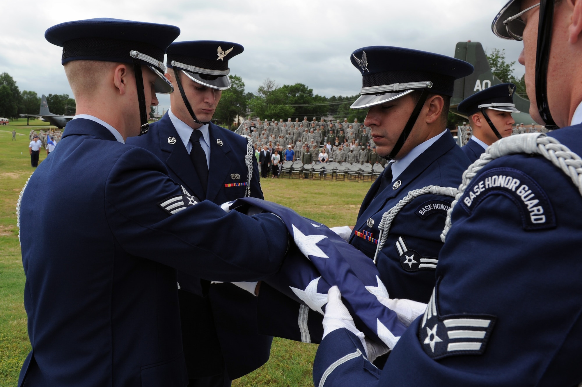 Members of the base honor guard fold the American flag during a Memorial Day retreat ceremony May 26, 2011, at Little Rock Air Force Base, Ark. The ceremony was a chance for Airmen to recognize the fallen men and women in the military through the years.  (U.S. Air Force photo /Airman 1st Class Rusty Frank)