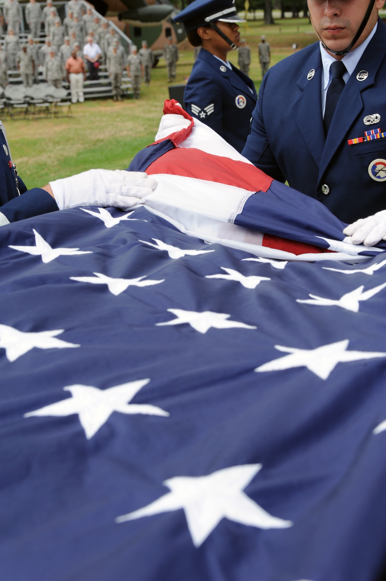 Members of the base honor guard fold the American flag during a Memorial Day retreat ceremony May 26, 2011, at Little Rock Air Force Base, Ark. The ceremony was a chance for Airmen to recognize the fallen men and women in the military through the years.  (U.S. Air Force photo /Airman 1st Class Rusty Frank)