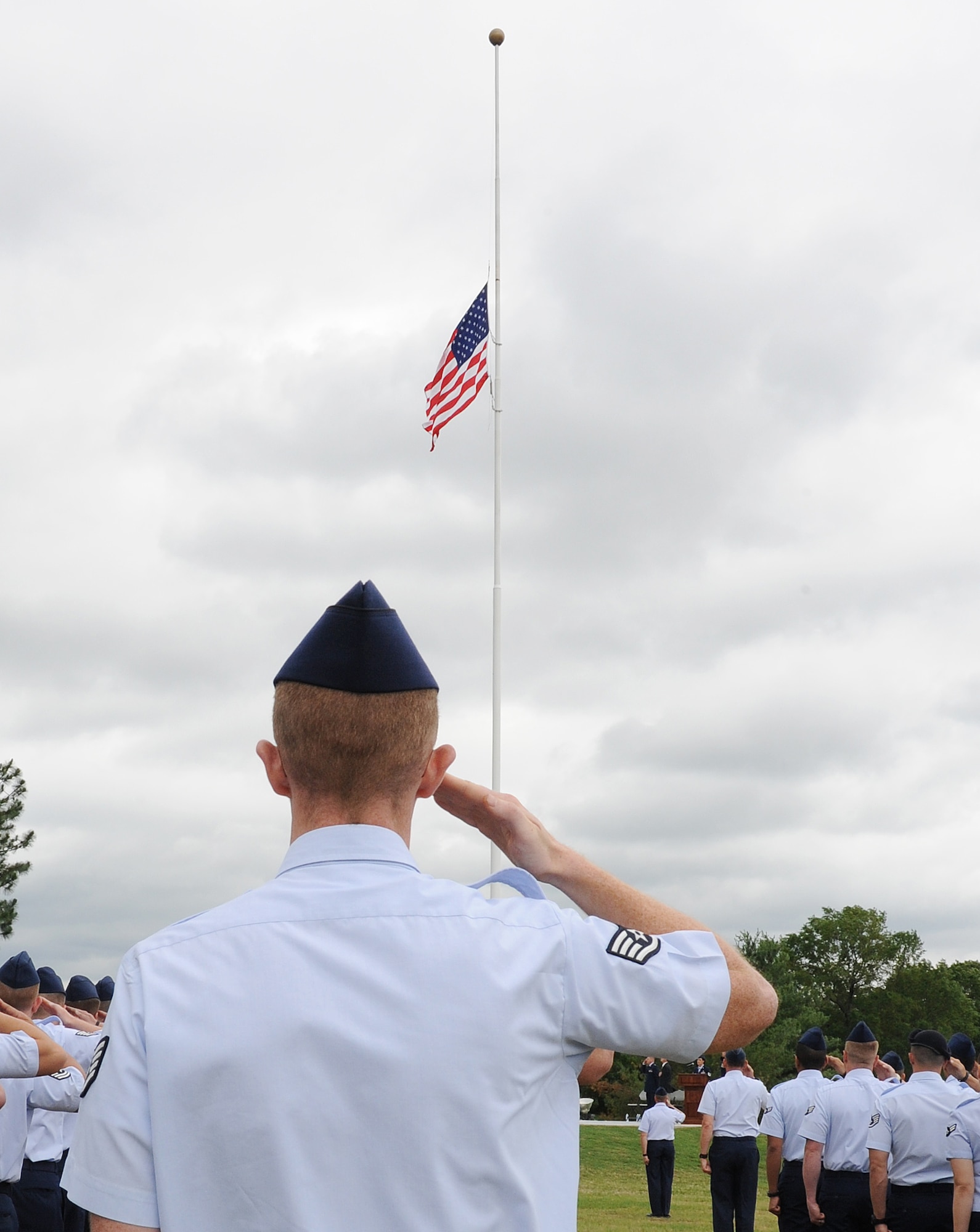 Team Little Rock Airmen salute the American flag during a Memorial Day retreat ceremony May 26, 2011, on Little Rock Air Force Base, Ark. The ceremony was a chance for Airmen and community members to honor the military men and women who have fallen through the years.  (U.S. Air Force photo/Airman 1st Class Ellora Stewart)